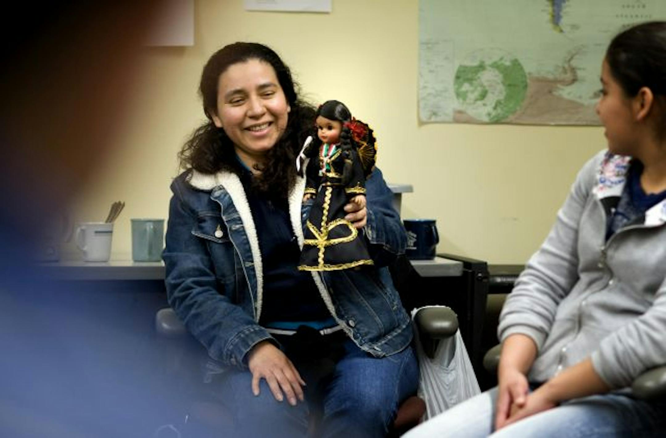 Leydi Nieves talked about her daughter's Mariachi doll from Mexico at Neighborhood House in St. Paul. English language students were asked to bring in something that represents their country of origin and share it with the class.