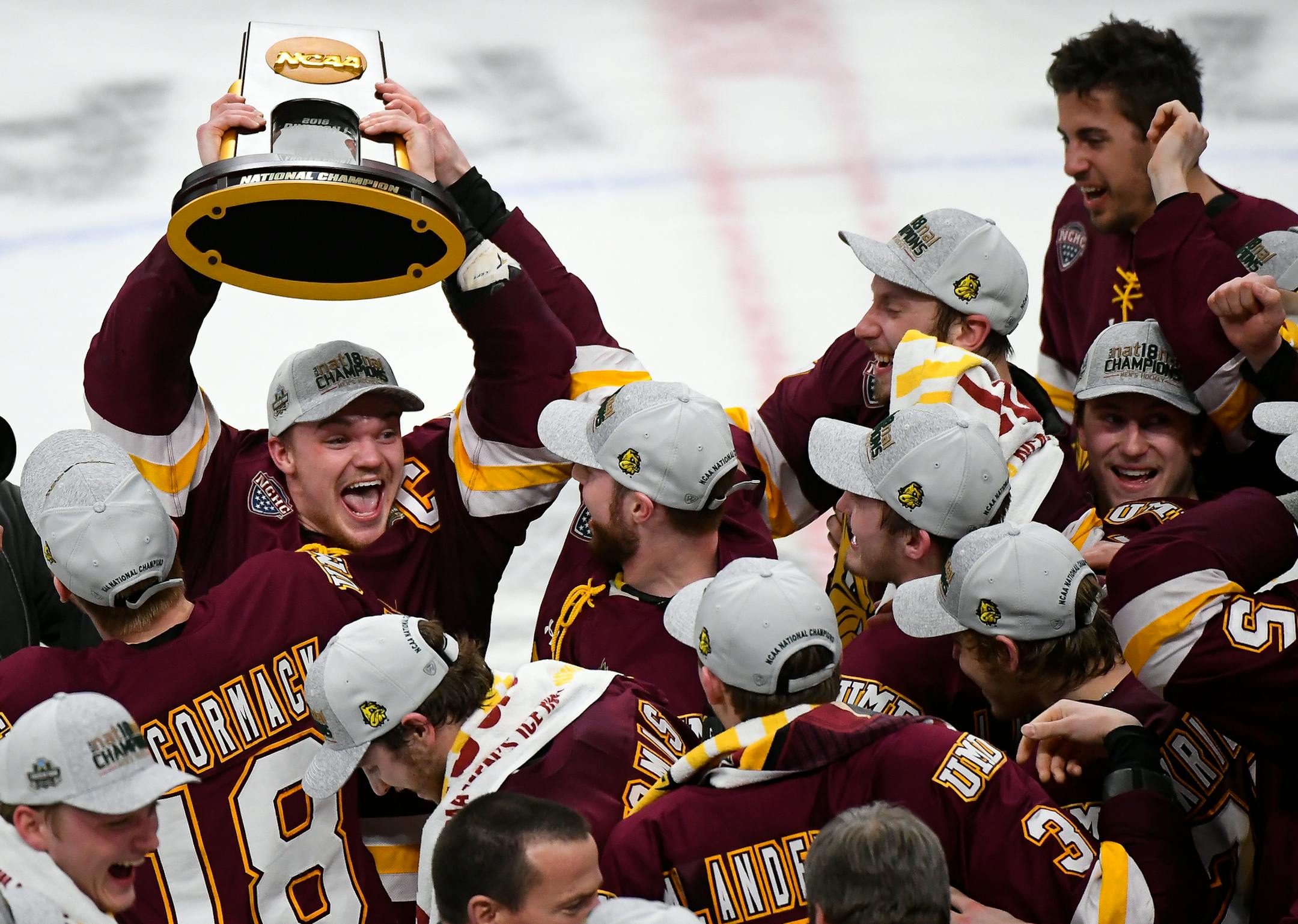 Minnesota-Duluth Bulldogs forward Karson Kuhlman (20) hoisted the NCAA championship trophy over his head while celebrating with teammates following their team's 2-1 victory over Notre Dame Fighting Irish in the national title game. ] AARON LAVINSKY &#xef; aaron.lavinsky@startribune.com The University of Minnesota-Duluth Bulldogs played the Notre Dame Fighting Irish in the NCAA Championship men's hockey game on Friday, April 6, 2018 at Xcel Energy Center in St. Paul, Minn.