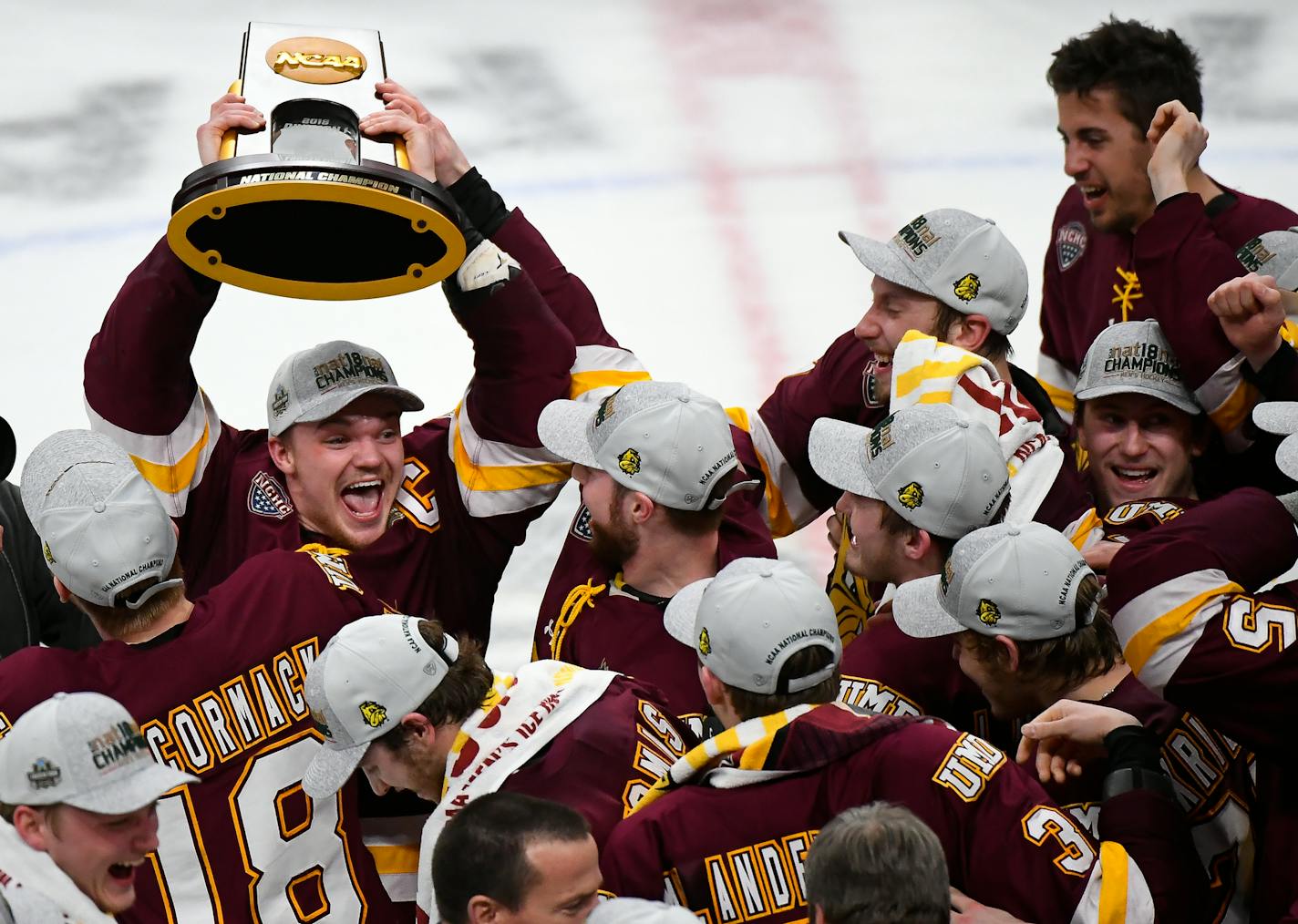 Minnesota-Duluth Bulldogs forward Karson Kuhlman (20) hoisted the NCAA championship trophy over his head while celebrating with teammates following their team's 2-1 victory over Notre Dame Fighting Irish in the national title game. ] AARON LAVINSKY &#xef; aaron.lavinsky@startribune.com The University of Minnesota-Duluth Bulldogs played the Notre Dame Fighting Irish in the NCAA Championship men's hockey game on Friday, April 6, 2018 at Xcel Energy Center in St. Paul, Minn.