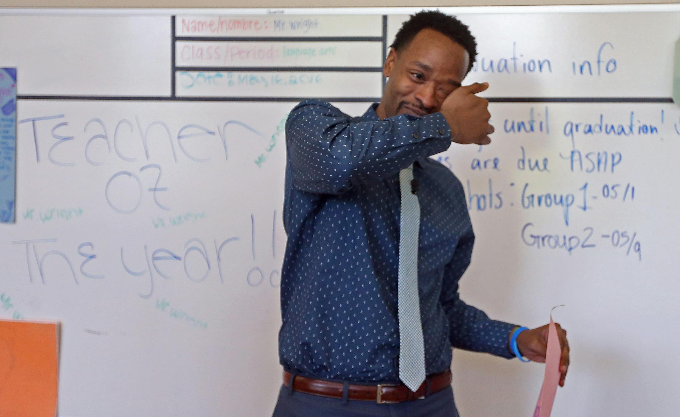 An emotional Abdul Wright wiped tears from his eyes after reading a congratulation letter given to him from his students after he returned to his school after winning the 2016 Minnesota Teacher of at the Best Academy Charter School Monday 16, 2016 in Minneapolis, MN.