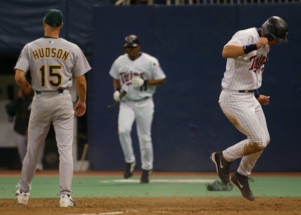 A.J. Pierzynski hops up after coming home on a wild pitch in the fourth inning during the 2002 playoffs.