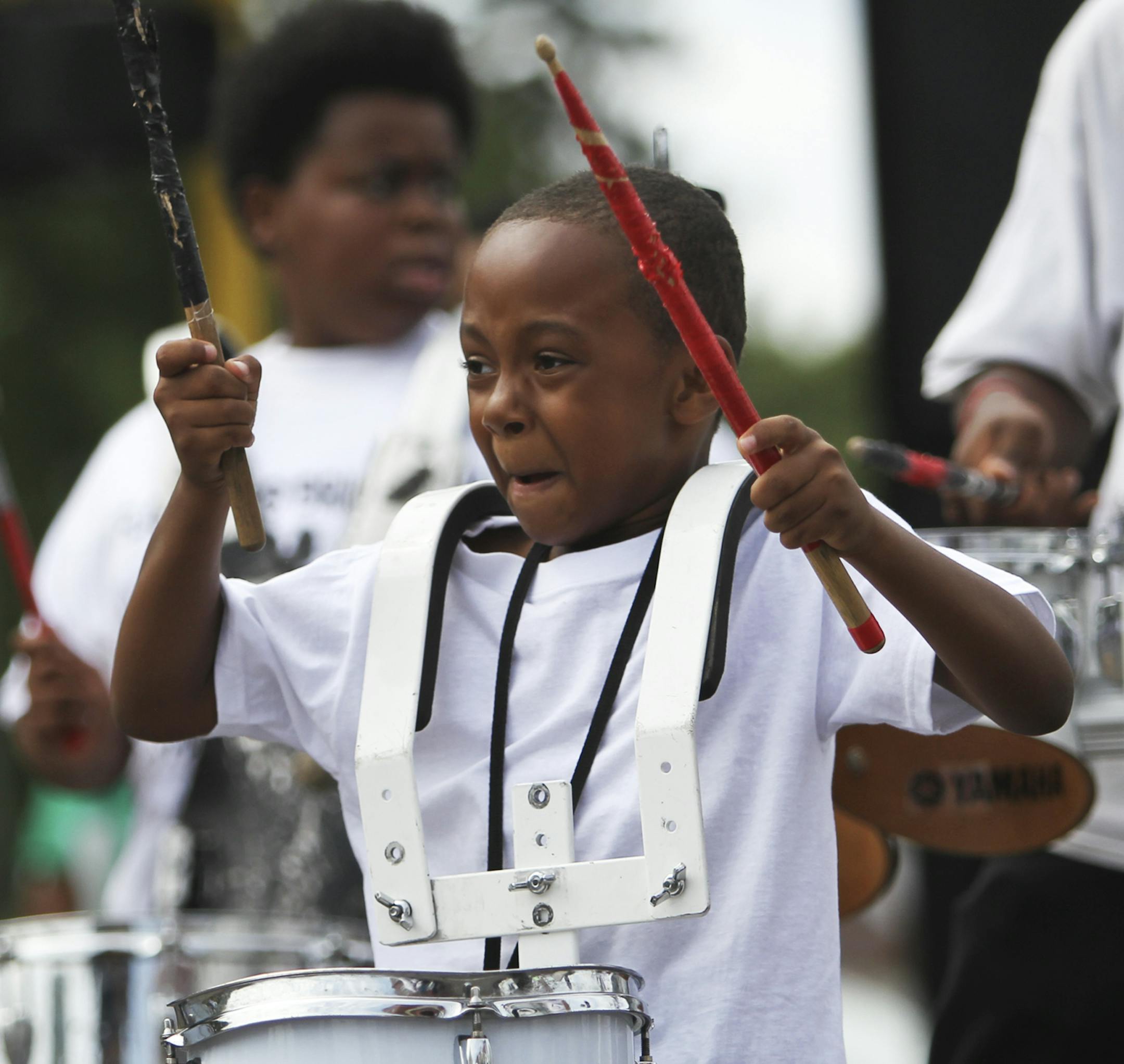 Tuyvaughn Young, 5, a drummer for the Flawless Drill Team of St. Paul, does his thing during a performance at the Family Day 2011 Back on the Block celebration Saturday, Aug. 27, in Minneapolis, MN.] - Minneapolis, MN DAVID JOLES * djoles@startribune.com -The Minneapolis Urban League held their Family Day 2011 Back on the Block celebration Saturday near Penn Ave. N. and Plymouth Ave.**Tuyvaughn Young, cq ORG XMIT: MIN2013081916463664