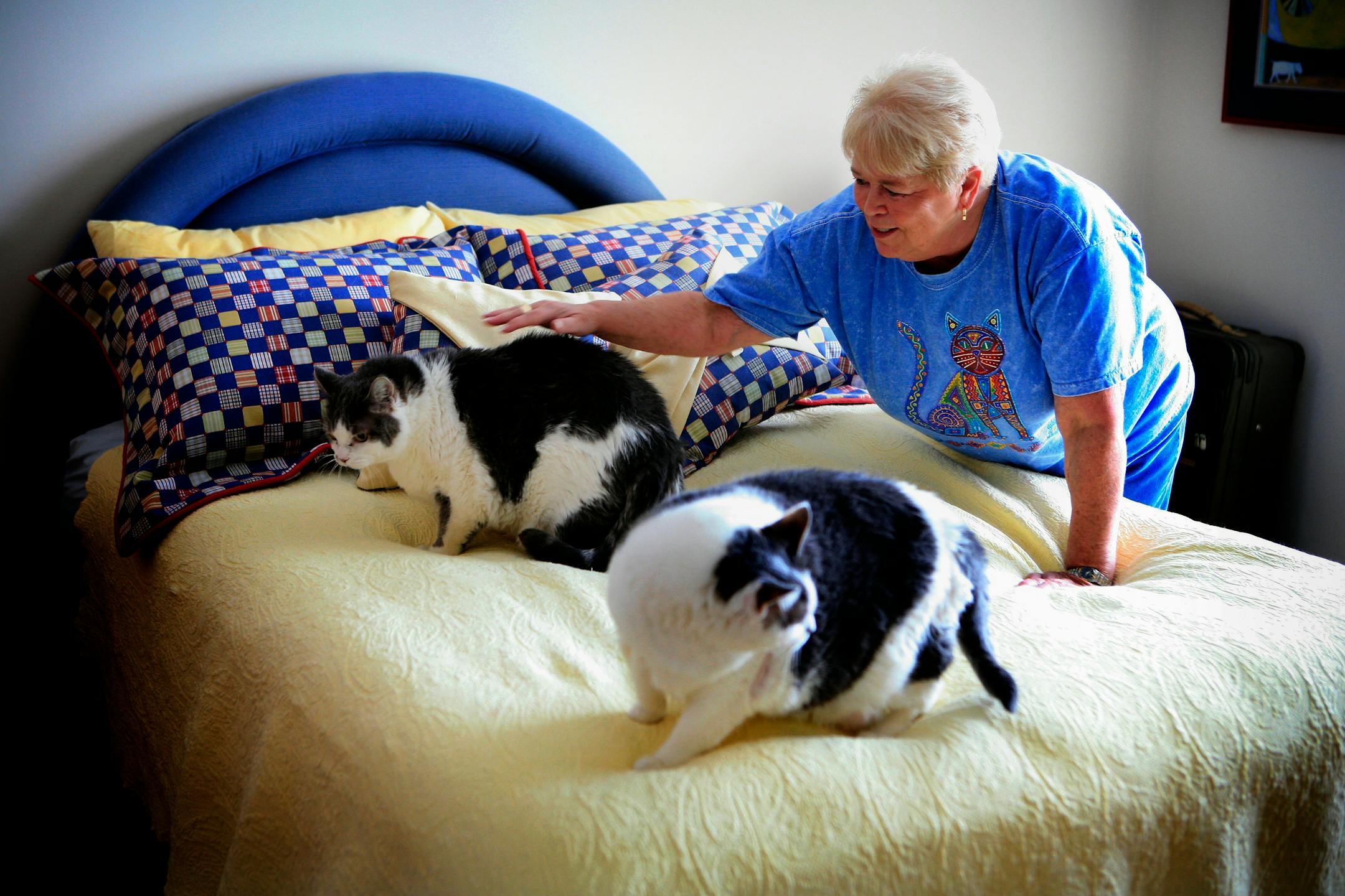 Carol Lee Hoskins at home with her two cats Daisy and Sammy. She has made arrangements through Angel Care to provide a permanent home for the two cats if she is unable to care for them.