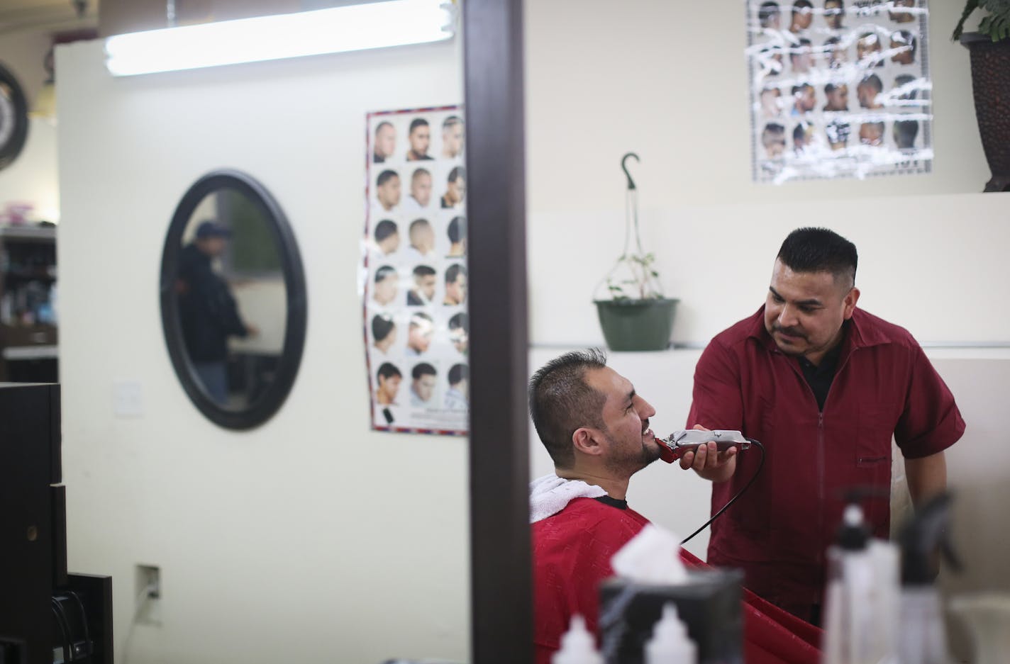 Diego Gomez gave Ricardo Sanchez a shave at a hair salon at Plaza Verde on Monday, February 22, 2016, in Minneapolis, Minn. ] RENEE JONES SCHNEIDER &#x2022; reneejones@startribune.com