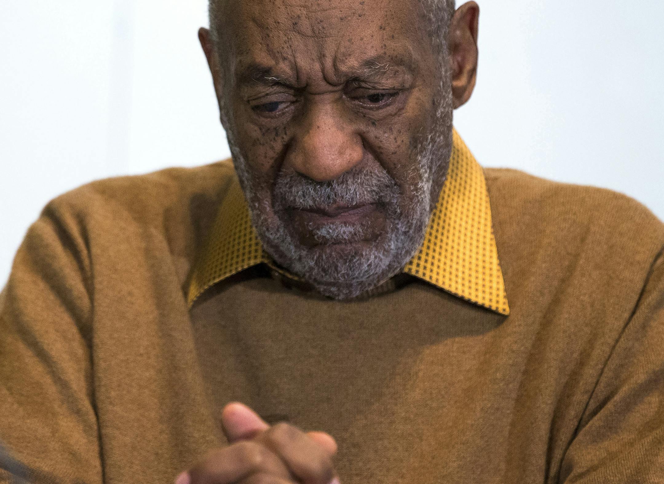 FILE - In this Nov. 6, 2014 file photo, entertainer Bill Cosby pauses during a news conference. Cosby's attorney said Sunday, Nov. 16, 2014 that Cosby will not dignify "decade-old, discredited" claims of sexual abuse with a response, the first reaction from the comedian to an increasing uproar over allegations that he sexually assaulted several women in the past. (AP Photo/Evan Vucci, File) ORG XMIT: MIN2014111711192522