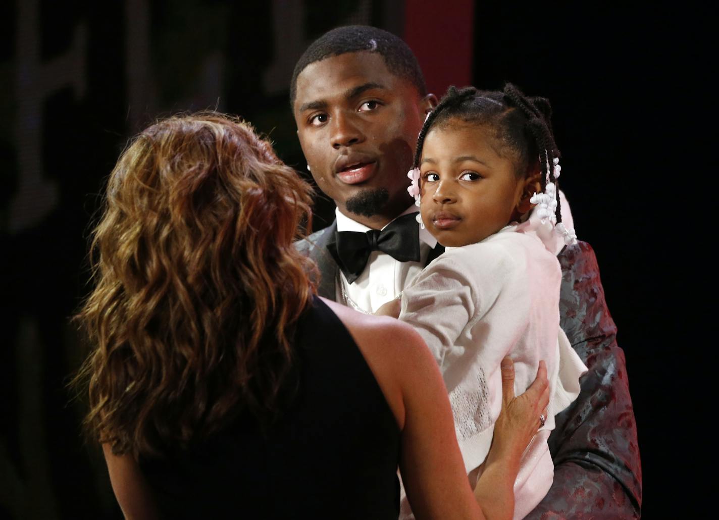 Mississippi&#xed;s Laquon Treadwell talks as he holds his daughter Madison after being selected by the Minnesota Vikings as the 23rd pick in the first round of the 2016 NFL football draft, Thursday, April 28, 2016, in Chicago. (AP Photo/Charles Rex Arbogast) ORG XMIT: ILKS217