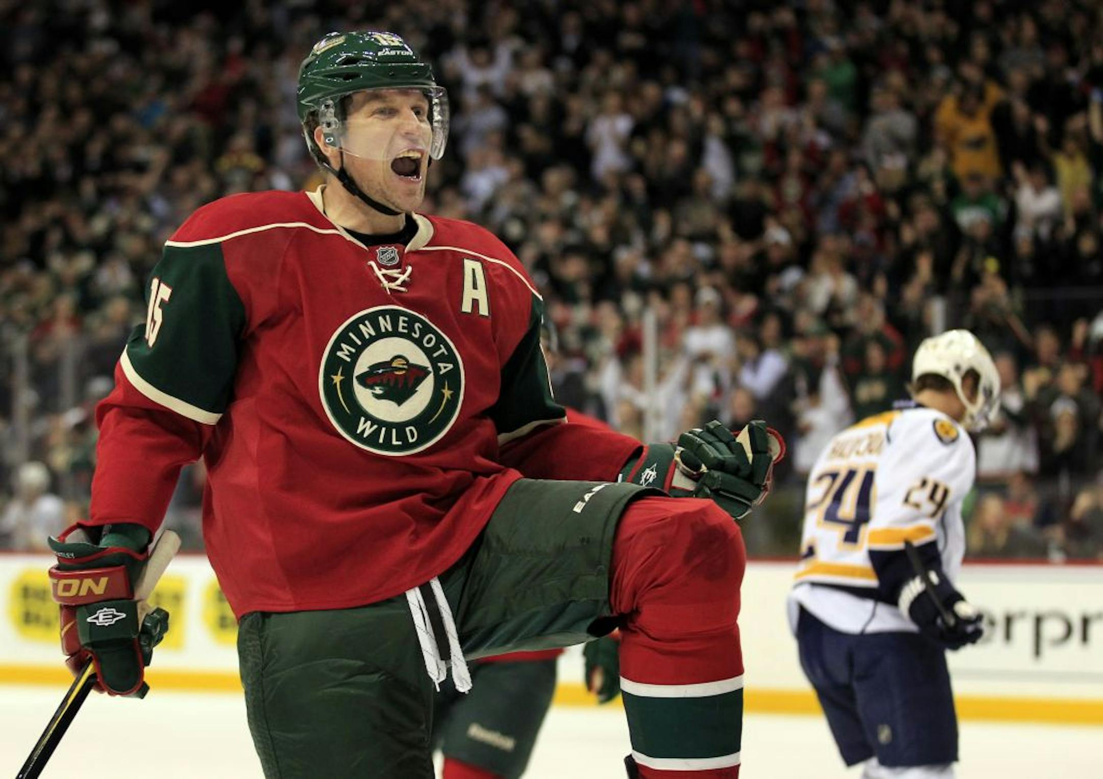 Dany Heatley (15) celebrated after scoring his second goal of the first period. Heatley had two goals in the period.