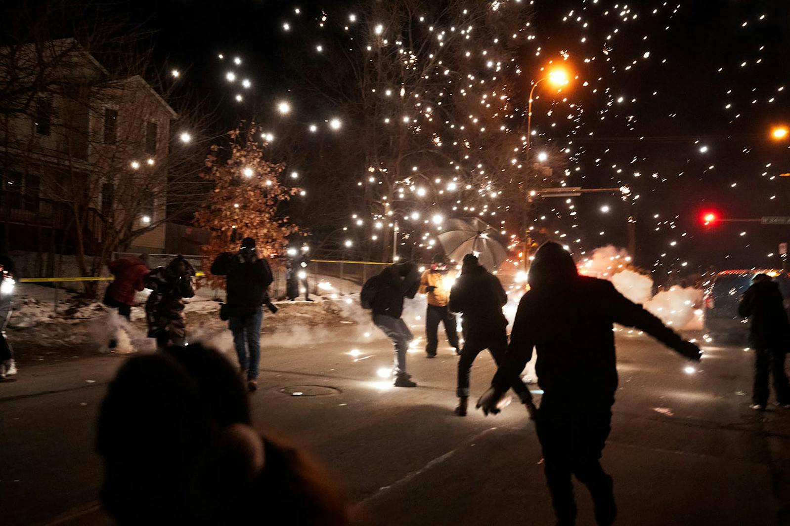 Protesters clash with ICE agents over the shooting of Julio Sosa-Celis, who was fleeing agents, in north Minneapolis Jan. 14, 2026. (Richard Tsong-Taatarii/The Minnesota Star Tribune/TNS) ORG XMIT: 165558328W