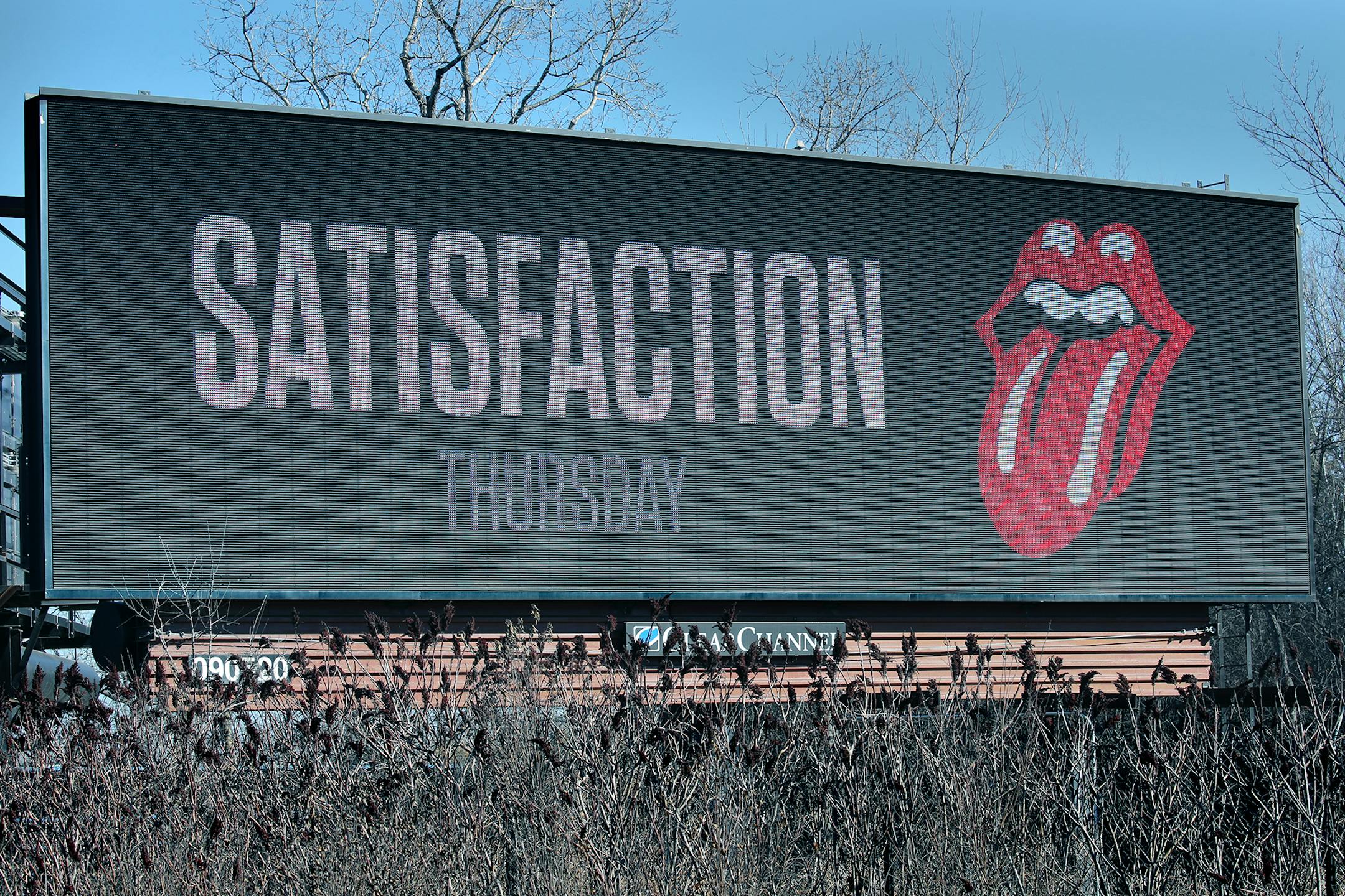 An electronic billboard with the Stones' tongue logo that says "Satisfaction Thursday," which would presumably mean they're announcing their local concert on Thu. Maybe a good standalone photo-op for over the weekend? They're popping up in other cities too, including Atlanta, Milwaukee, Columbus and Buffalo (they're really hitting America's most beautiful metropolises!. It's on 494 going west (by northwest) jus past the 62 insect.