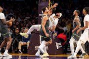 Lakers forward Anthony Davis reacts after getting hit in the eye by Wolves forward Kyle Anderson in the first half Sunday night in Los Angeles. Davis 