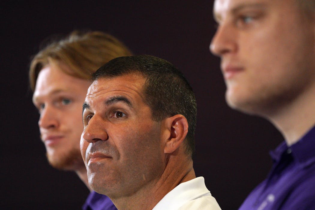 St. Thomas football coach Glenn Caruso, flanked by players Luke Swenson, left, and Elijah Rice, took a question during a news conference Tuesday. The Tommies have two more seasons left in the MIAC after being booted out of the conference by other member schools.