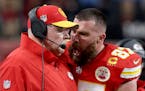 Travis Kelce, right, bumped coach Andy Reid during the second quarter of the Super Bowl. Tribune News Service.