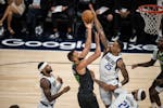 Mavericks forward P.J. Washington pressures Timberwolves center Rudy Gobert in the first quarter of Game 5 of the Western Conference finals at Target 