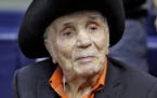 FILE - In this Sept. 15, 2015, file photo, Jake LaMotta watches batting practice before a baseball game between the Tampa Bay Rays and the New York Ya