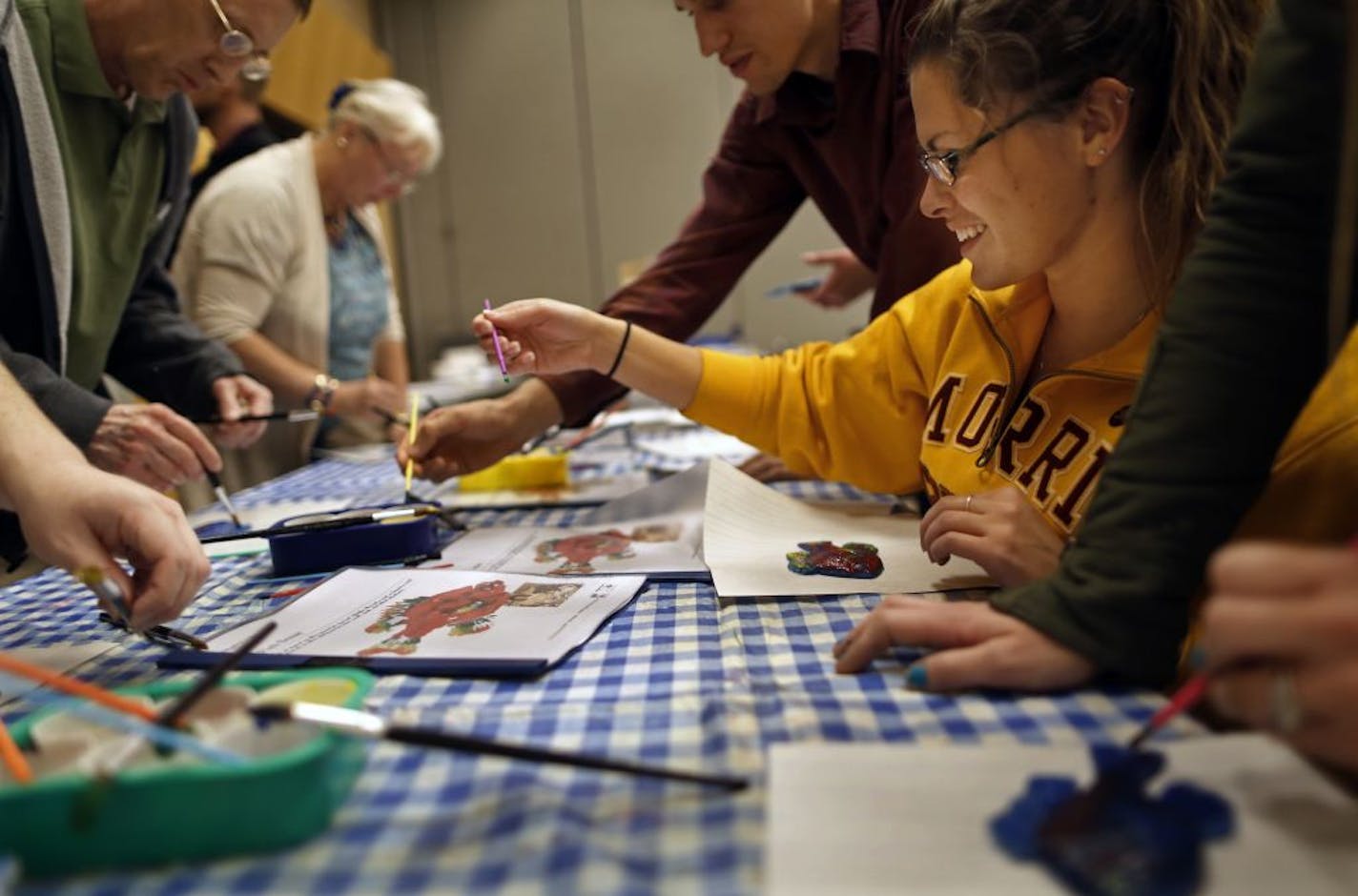 At the Education Minn. 2012 Prof. Conference, held at the Saint Paul River Centre, student teacher Ashley Splonskowski of U of M Morris tried her hand at making a fish print. The classed, sponsored by the DNR, aims to get more kids involed with the outdoors .