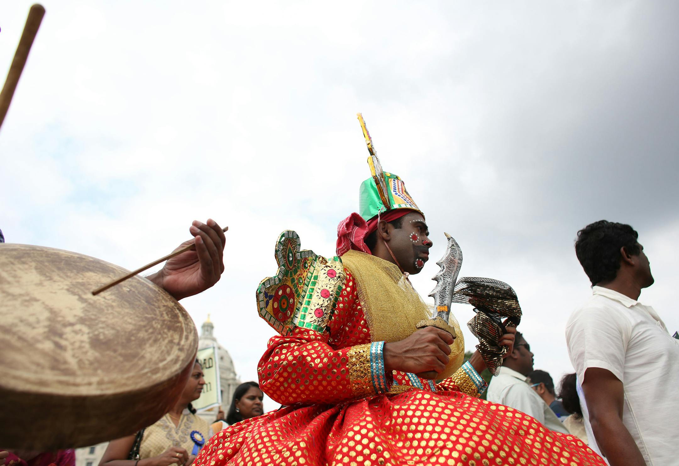 Members of the Minnesota Tamil Sangam walked in a parade along the Capitol grounds. ] (KYNDELL HARKNESS/STAR TRIBUNE) kyndell.harkness@startribune.com ndia Fest, an annual celebration of Minnesota's 40,000 South Asian Indian residents. Gov. Mark Dayton, who attended, proclaimed it "India Fest Day." in St. Paul Min,. Saturday, August, 16, 2014.