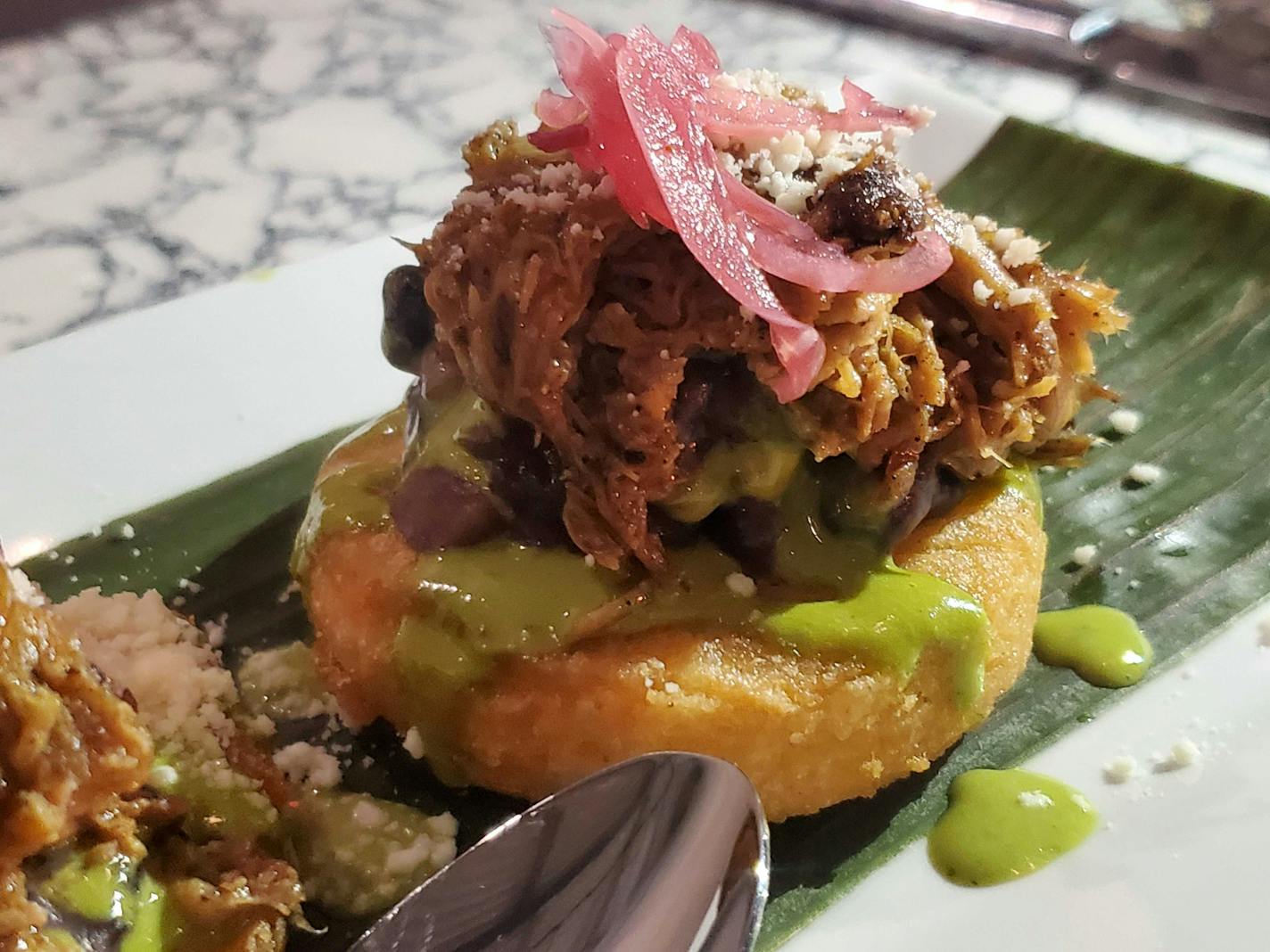 Arepa with lechon from Guacaya Bistreaux pop-up