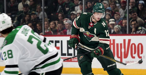 Eric Staal (12) tried to get control of the puck in the first period.