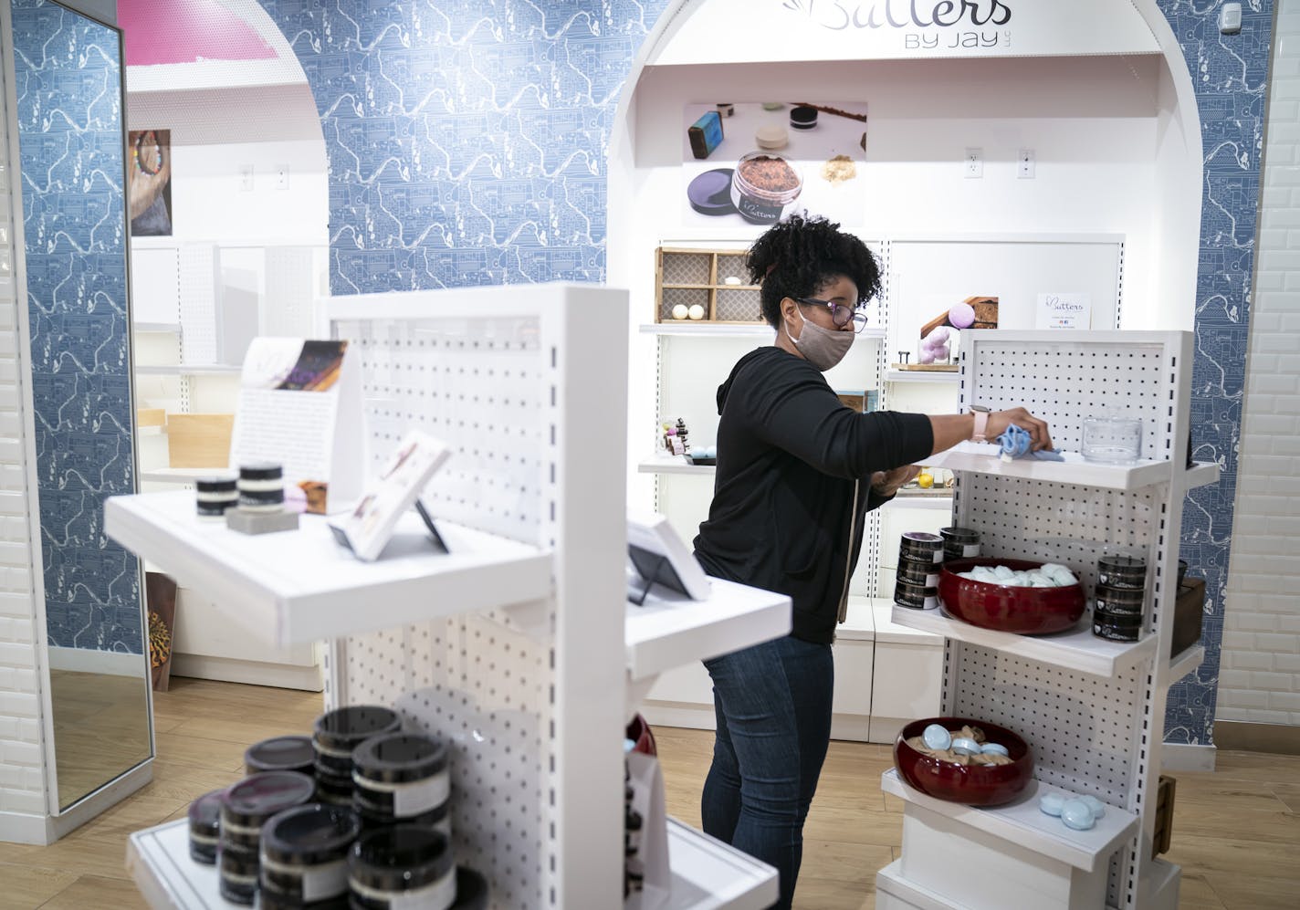 Jasmine McConnell sets up her display for her soap, lotion and bath product shop Butters by Jay at the Community Commons space at the Mall of America in Bloomington, Minn., on Tuesday, September 29, 2020. McConnell's products were in businesses that have seen a downturn in business since Coronavirus. ] RENEE JONES SCHNEIDER renee.jones@startribune.com The Mall of America is offering free space called Community Commons. for 17 small businesses that were impacted by the pandemic and the riots afte