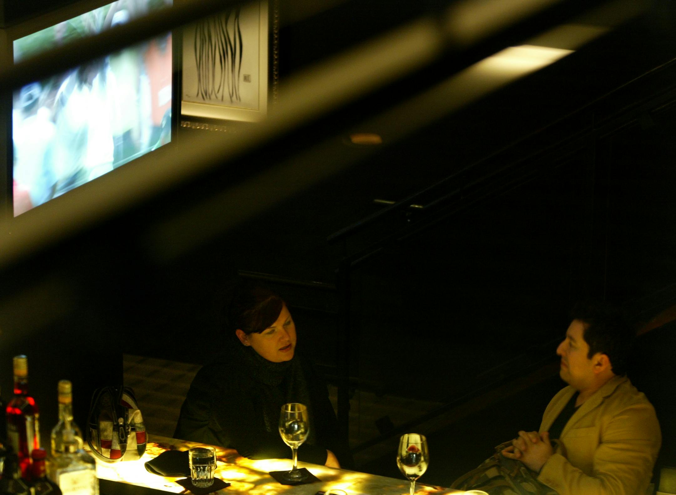 Leah Steig and Rich G. both of Minneapolis enjoy a glass of wine at the bar on the main level.