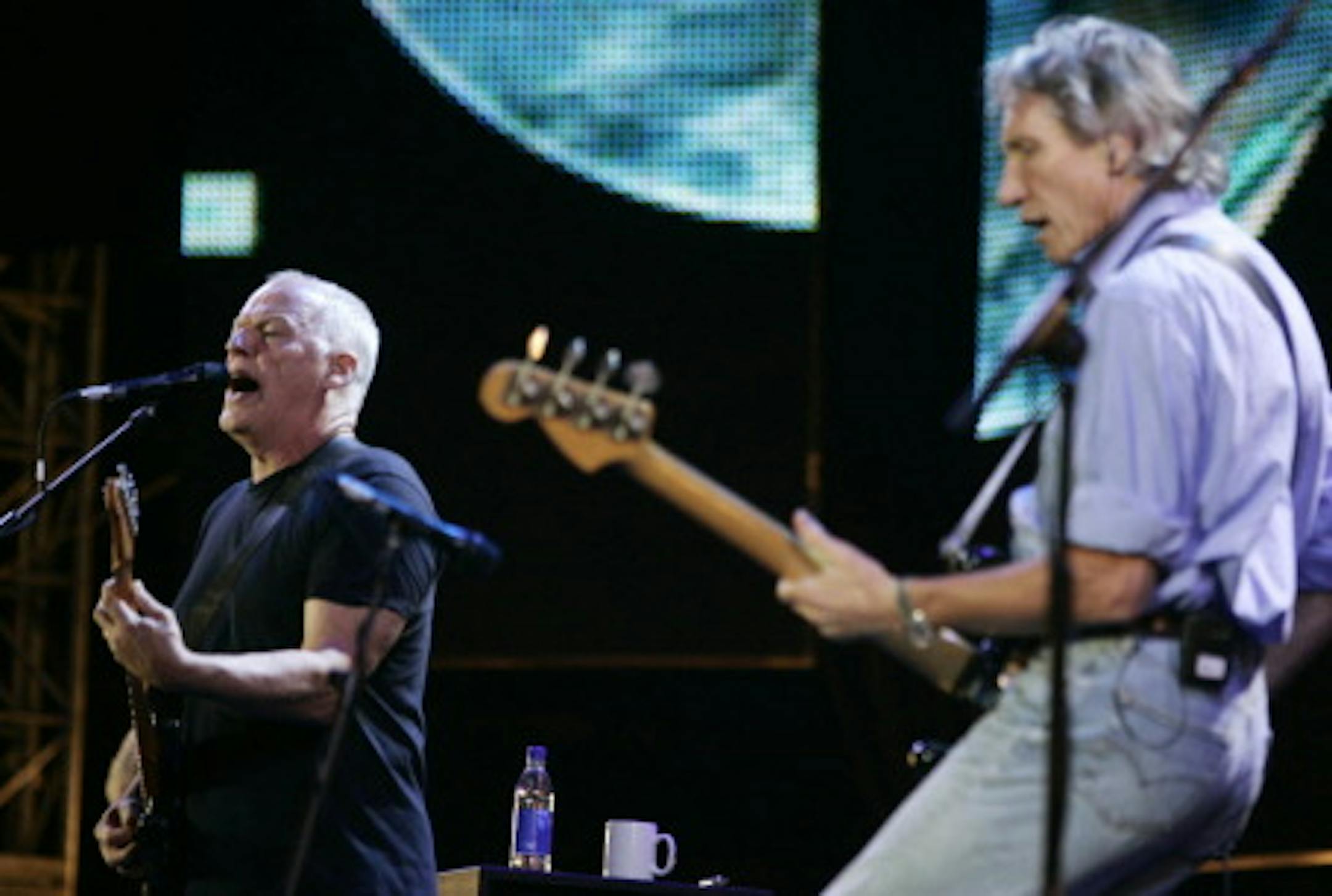 David Gilmour and Roger Waters performing together at the Live8 concert in 2005. / Associated Press