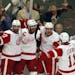 The Detroit Red Wings' Henrik Zetterberg, second from left, celebrates his third-period goal against the Chicago Blackhawks in Game 7 of Western Confe
