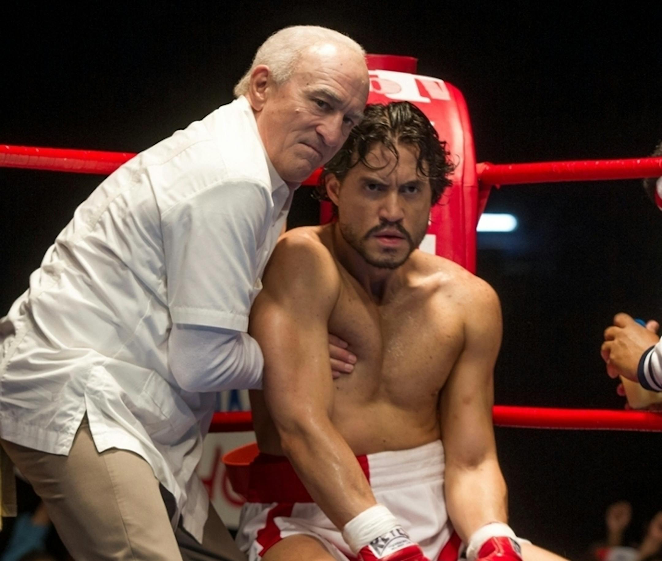 This image released by The Weinstein Company shows Robert De Niro, left, and Edgar Ramirez in a scene from, "Hands of Stone." (Rico Torres/The Weinstein Company via AP)