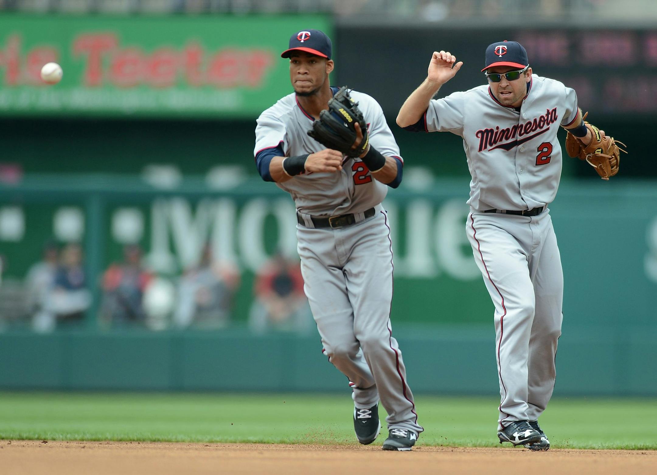 Twins second baseman Brian Dozier (2) avoied bumping into shortstop Pedro Florimon during a game earlier this season.