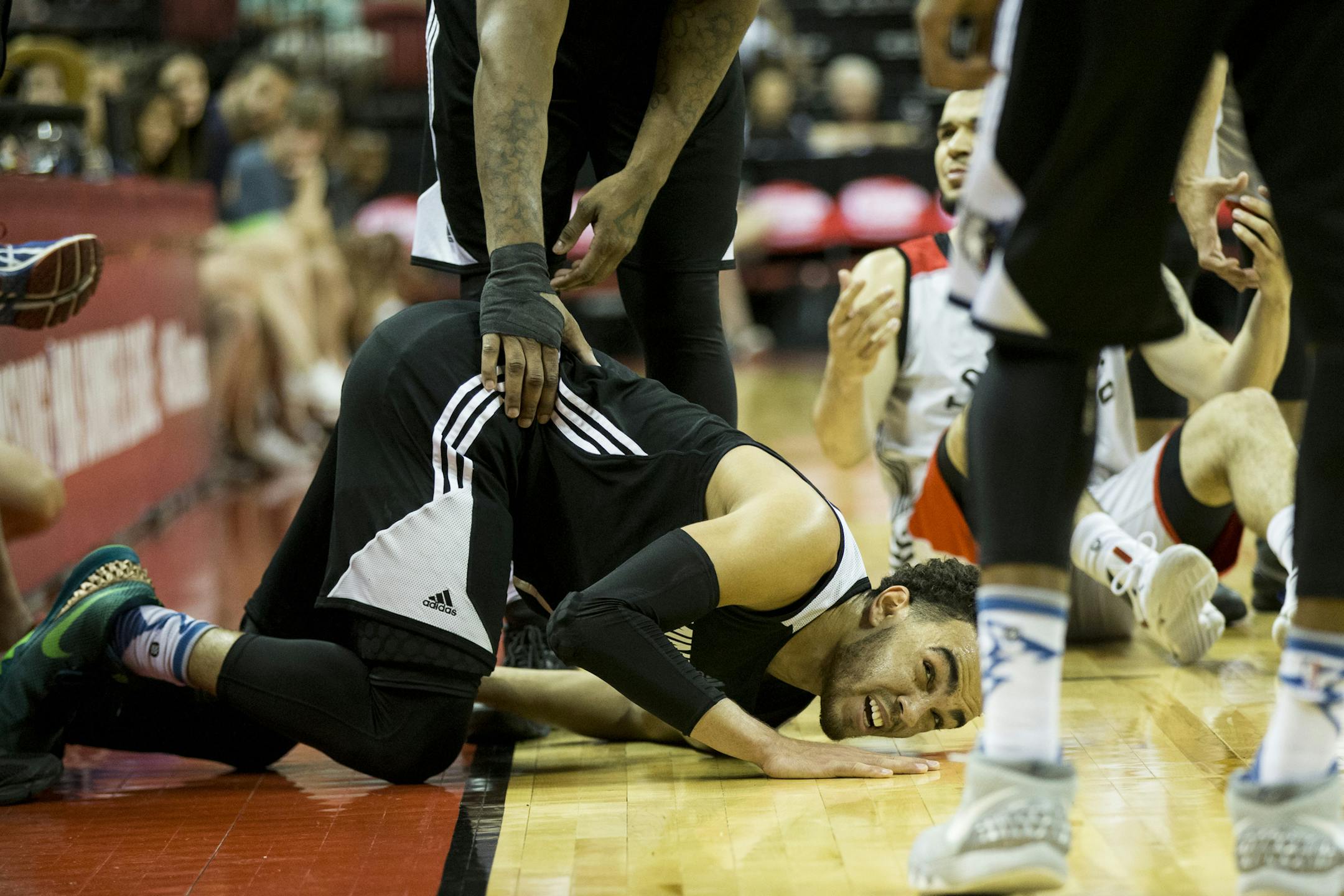 Minnesota Timberwolves’ Tyus Jones (1) takes a fall against the Toronto Raptors during an NBA summer league basketball game Saturday, July 16, 2016, in Las Vegas. The Timberwolves won 81-79. (Erik Verduzco/Las Vegas Review-Journal via AP)