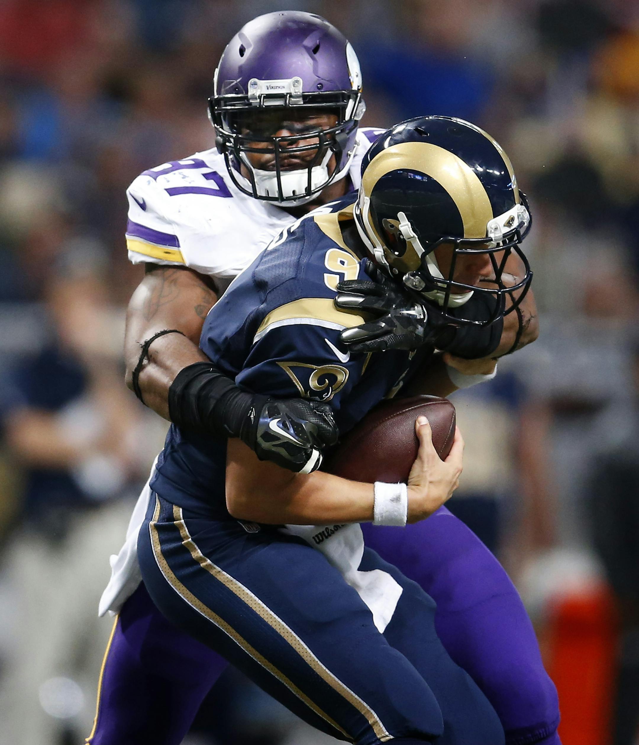 Everson Griffen (97) sacked Rams quarterback Austin Davis (9) in the fourth quarter. ] CARLOS GONZALEZ cgonzalez@startribune.com - September 7, 2014, St. Louis, MO, NFL, Edward Jones Dome, Minnesota Vikings vs. St. Louis Rams