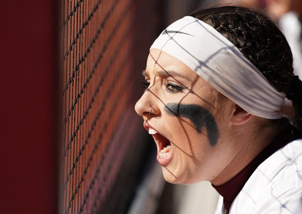 Gophers' first baseman Hope Brandner, above cheering from the dugout, has helped compensate for the loss of slugger Kendyl Lindaman.