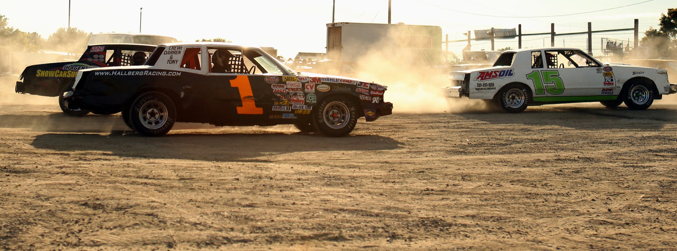 Racers raise dust and head to the track during the "Pack the Stands" event at Raceway Park in Shakopee, Minn., on Sunday, August 4, 2013. ] (ANNA REED/STAR TRIBUNE) anna.reed@startribune.com (cq)