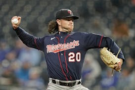 Minnesota Twins starting pitcher Chris Paddack throws during the first inning of a baseball game against the Kansas City Royals Wednesday, April 20, 2