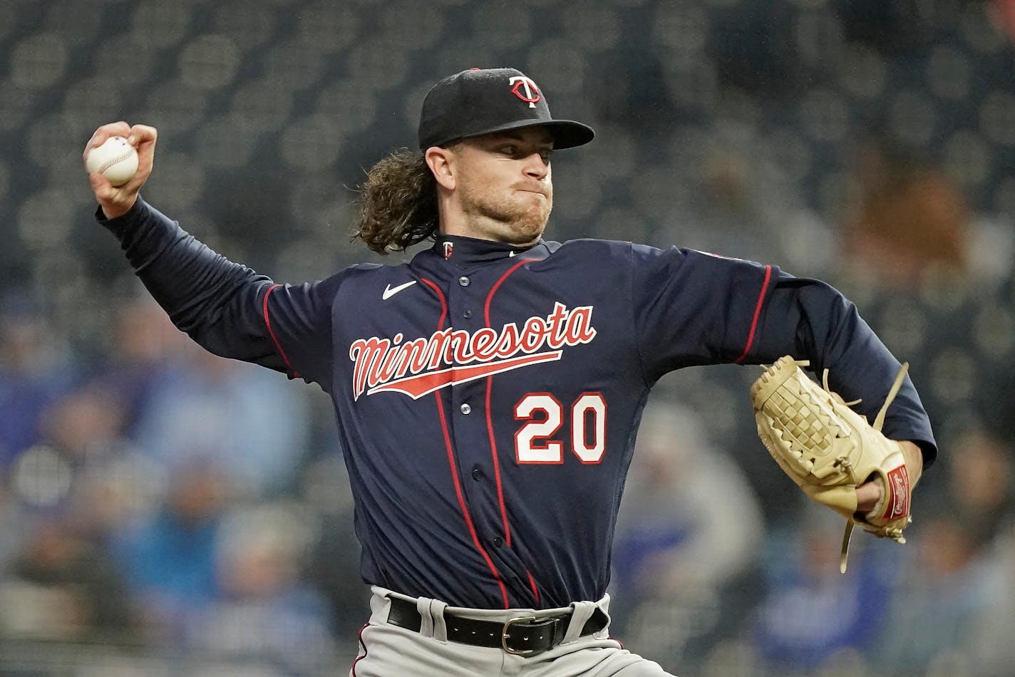 Minnesota Twins starting pitcher Chris Paddack throws during the first inning of a baseball game against the Kansas City Royals Wednesday, April 20, 2022, in Kansas City, Mo. (AP Photo/Charlie Riedel)