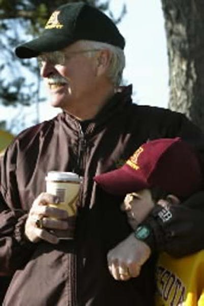 Gophers women's cross-country coach Gary Wilson with Big Brothers/Big Sisters friend Jordan Severson at a meet at Les Bolstad Golf Course in 2006.
