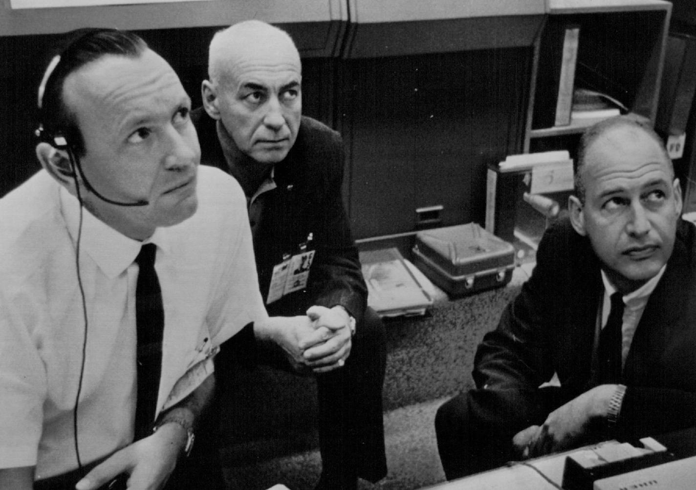 August 22, 1965 Make Decision -- Top men at the Manned Spacecraft Center in Houston, Tex., are shown as they decide to continue the flight of Gemini 5 through 33 orbits today. Left to right are: Christopher C. Kraft, flight director; Dr. Robert H. Gilruth, director, Manned Spacecraft Center and George Low, deputy director of Manned Spacecraft Center. August 24, 1965 NASA Photo; Associated Press Wirephoto ORG XMIT: MIN2015041715102739