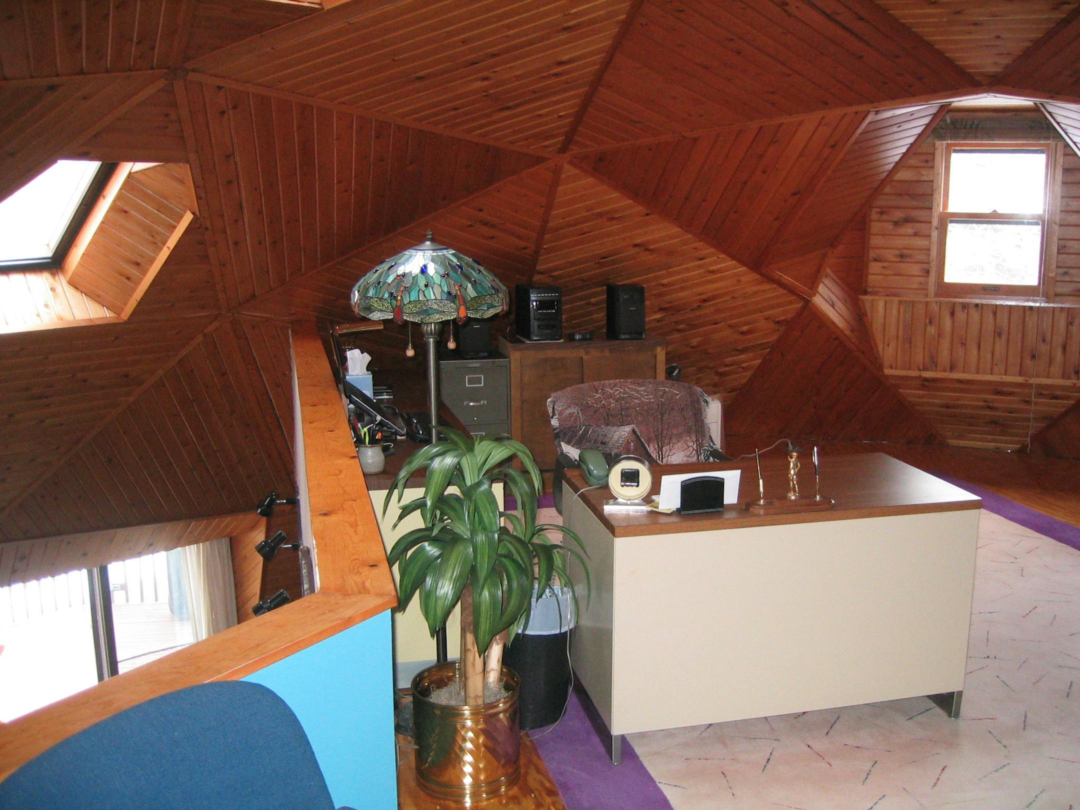 The upper level loft overlooks the living areas.