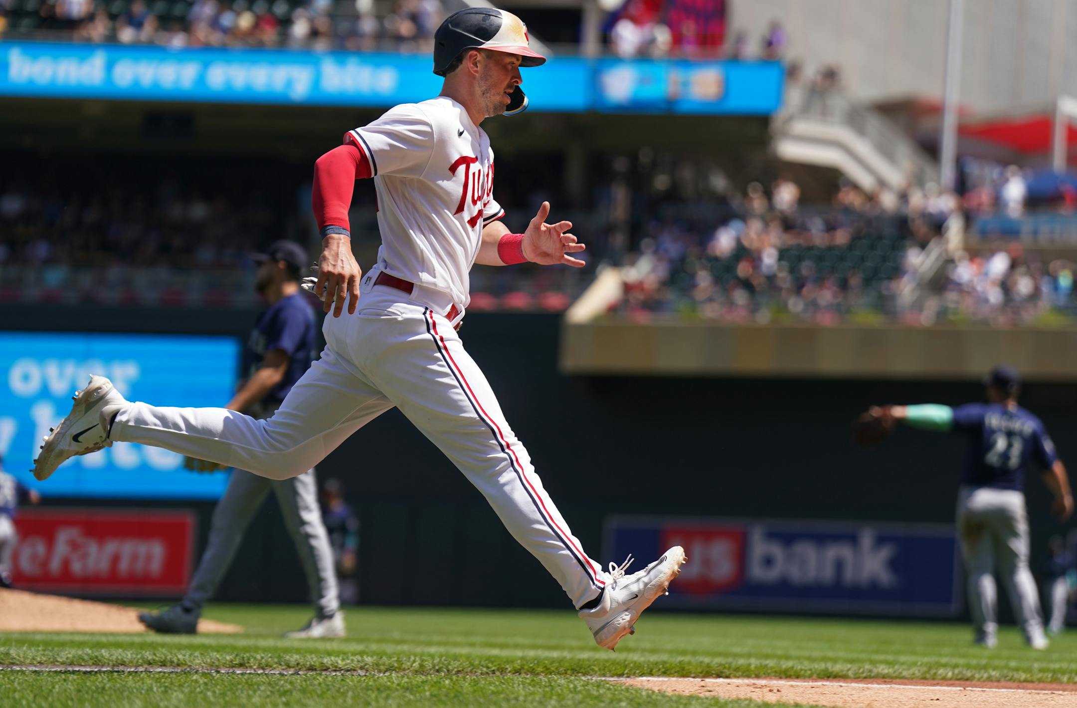 Minnesota Twins third baseman Kyle Farmer (12) scores on a double on a double by Minnesota Twins left fielder Joey Gallo (13) in the sixth inning.