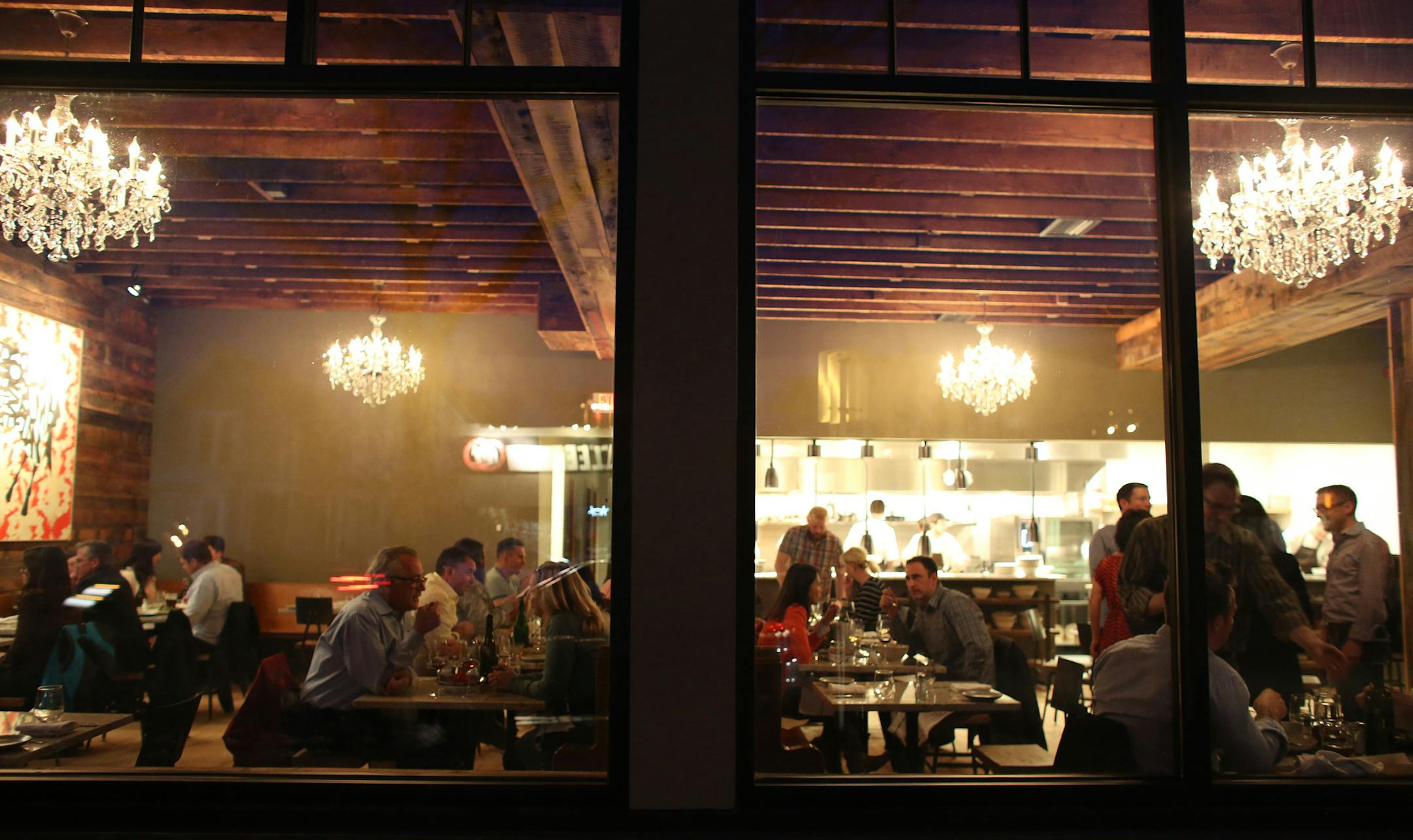 Looking through the front window at the dining area at Heyday. ] (KYNDELL HARKNESS/STAR TRIBUNE) kyndell.harkness@startribune.com At the soft opening of Heyday in Minneapolis, Min., Friday April 18, 2014.