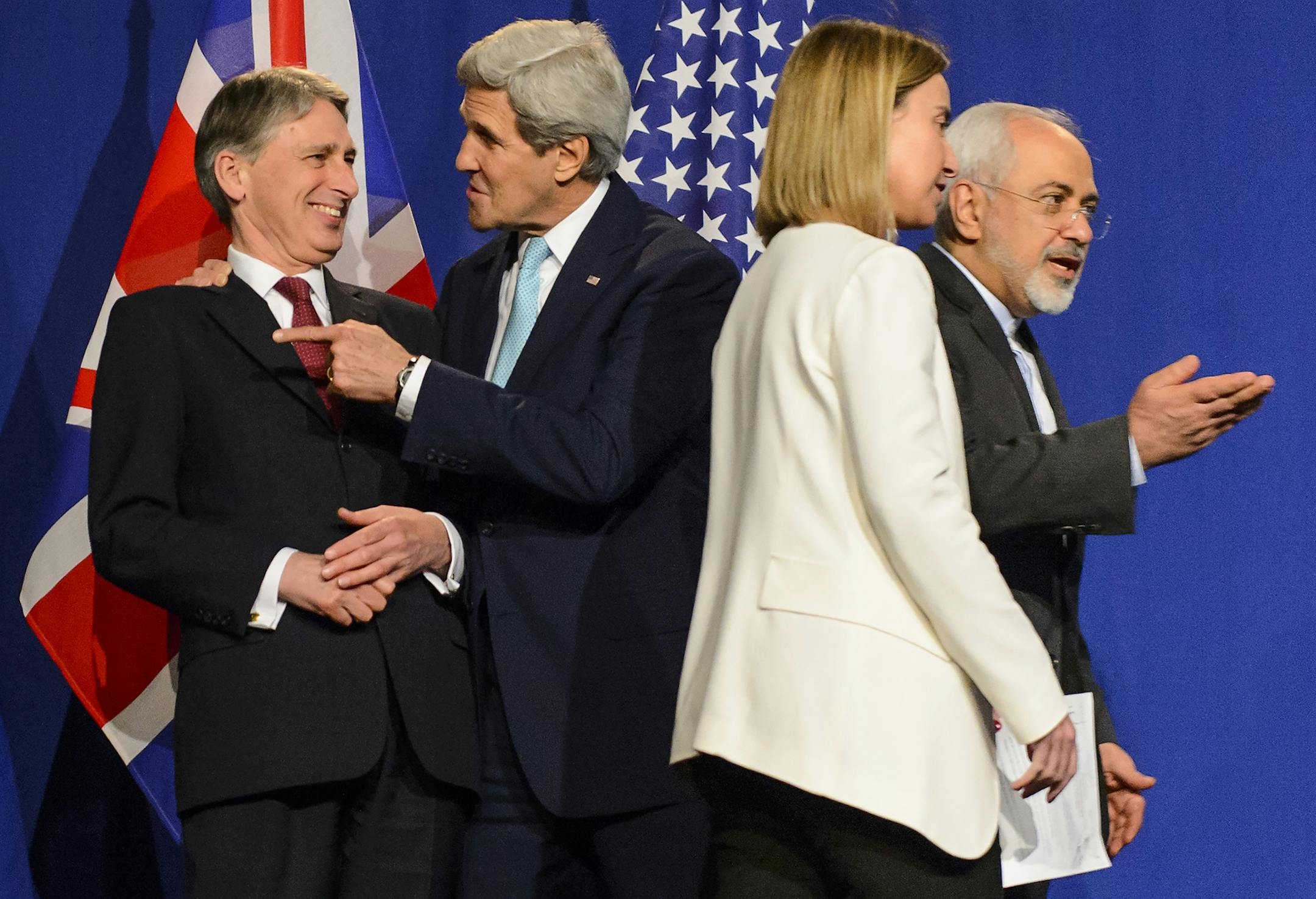 From left, British Foreign Secretary, Philip Hammond, U.S. Secretary of State, John Kerry, EU High Representative for Foreign Affairs and Security Policy, Federica Mogherini, and Iranian Foreign Minister, Mohammad Javad Zarif, prepare for a press event after the end of a new round of Nuclear Iran Talks in the Learning Center at the Swiss federal Institute of Technology (EPFL), in Lausanne, Switzerland, Thursday, April 2, 2015. (AP Photo/Keystone, Jean-Christophe Bott)