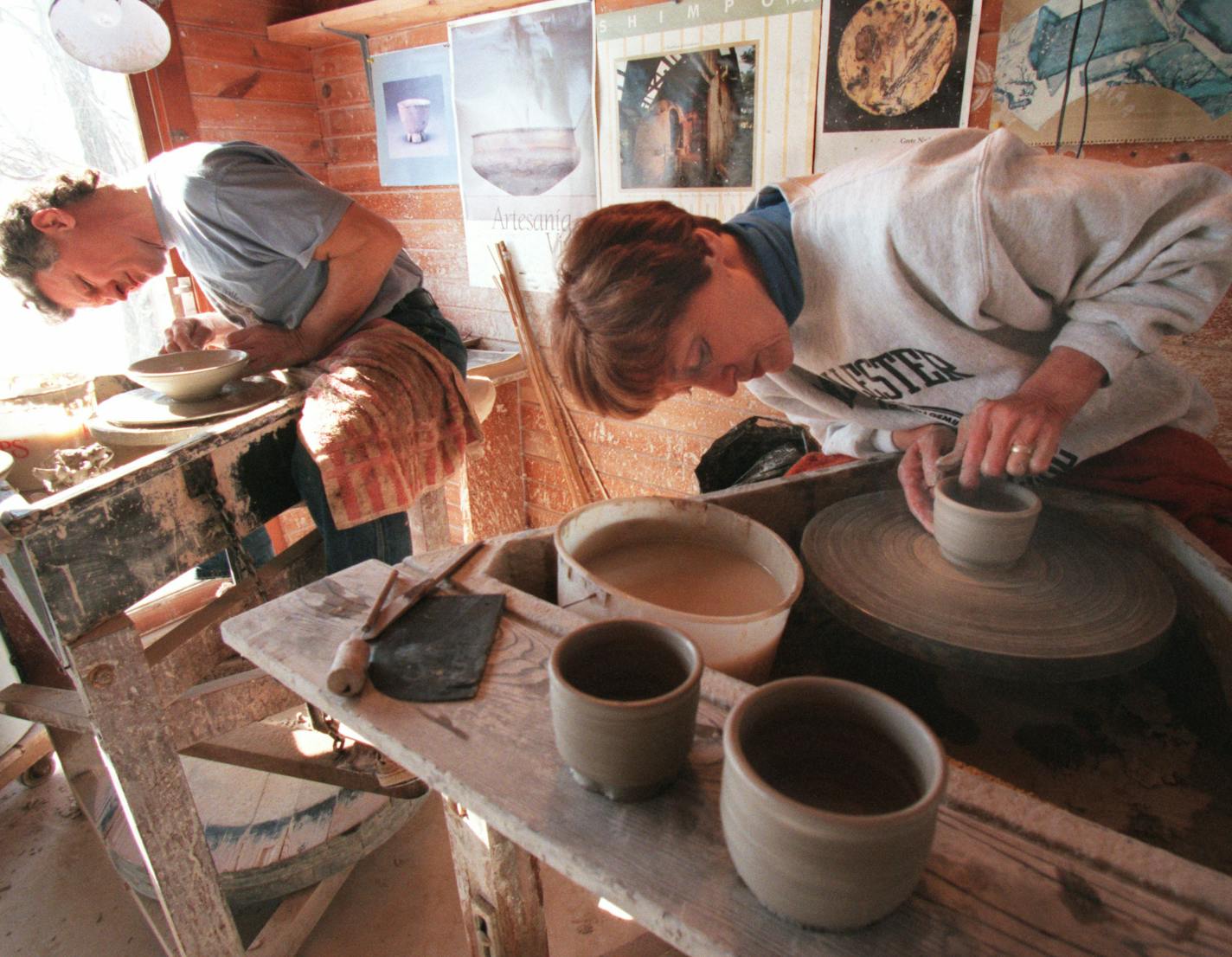 Joan Mondale moulded a pot at the Warren McKenzie studio along with fellow artist Kerry Rasmussen. The studio is near the Stillwater area. Star Tribune photo Bruce Bisping 2/13/97 Stillwater, MN