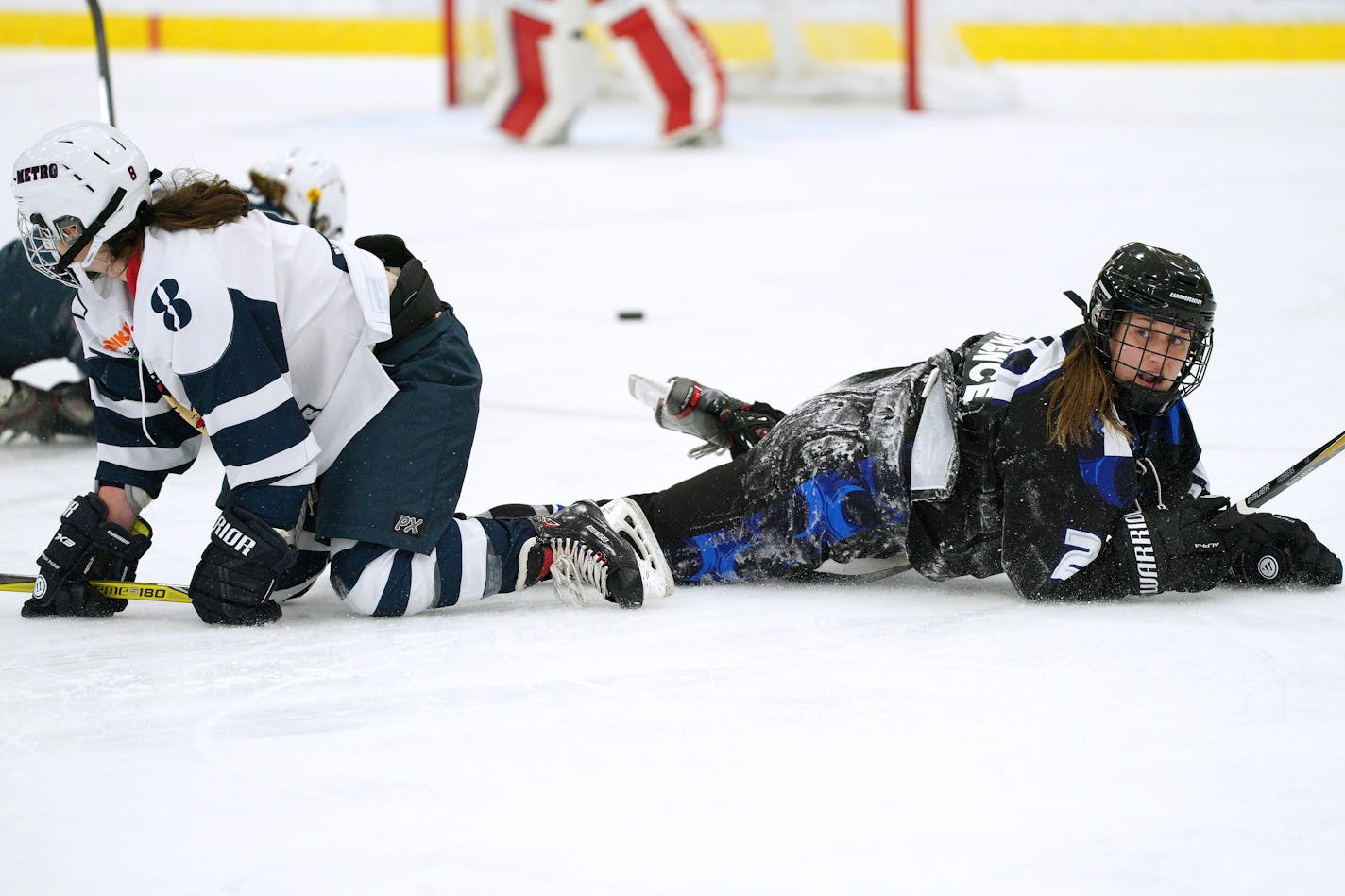 Whitecaps forward Meghan Lorence, right, and Riveters defenseman Colleen Murphy collided during Saturday's game.