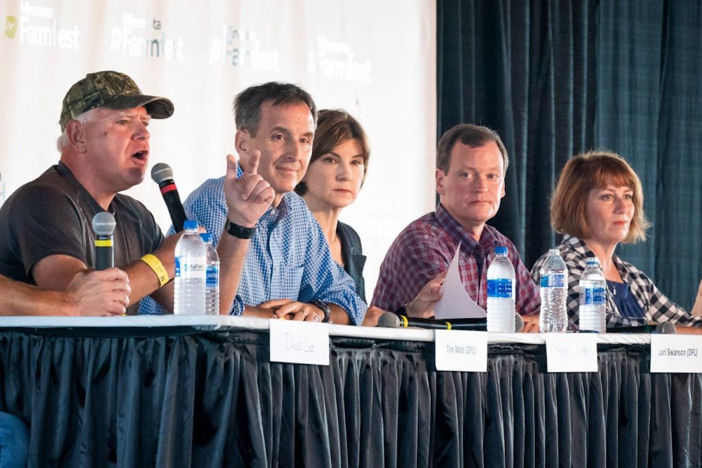 The five main Minnesota gubernatorial candidates, shown at FarmFest on Wednesday: From left: DFLer Tim Walz, Republican Tim Pawlenty, DFLer Lori Swanson, the GOP's Jeff Johnson and Democrat Erin Murphy.