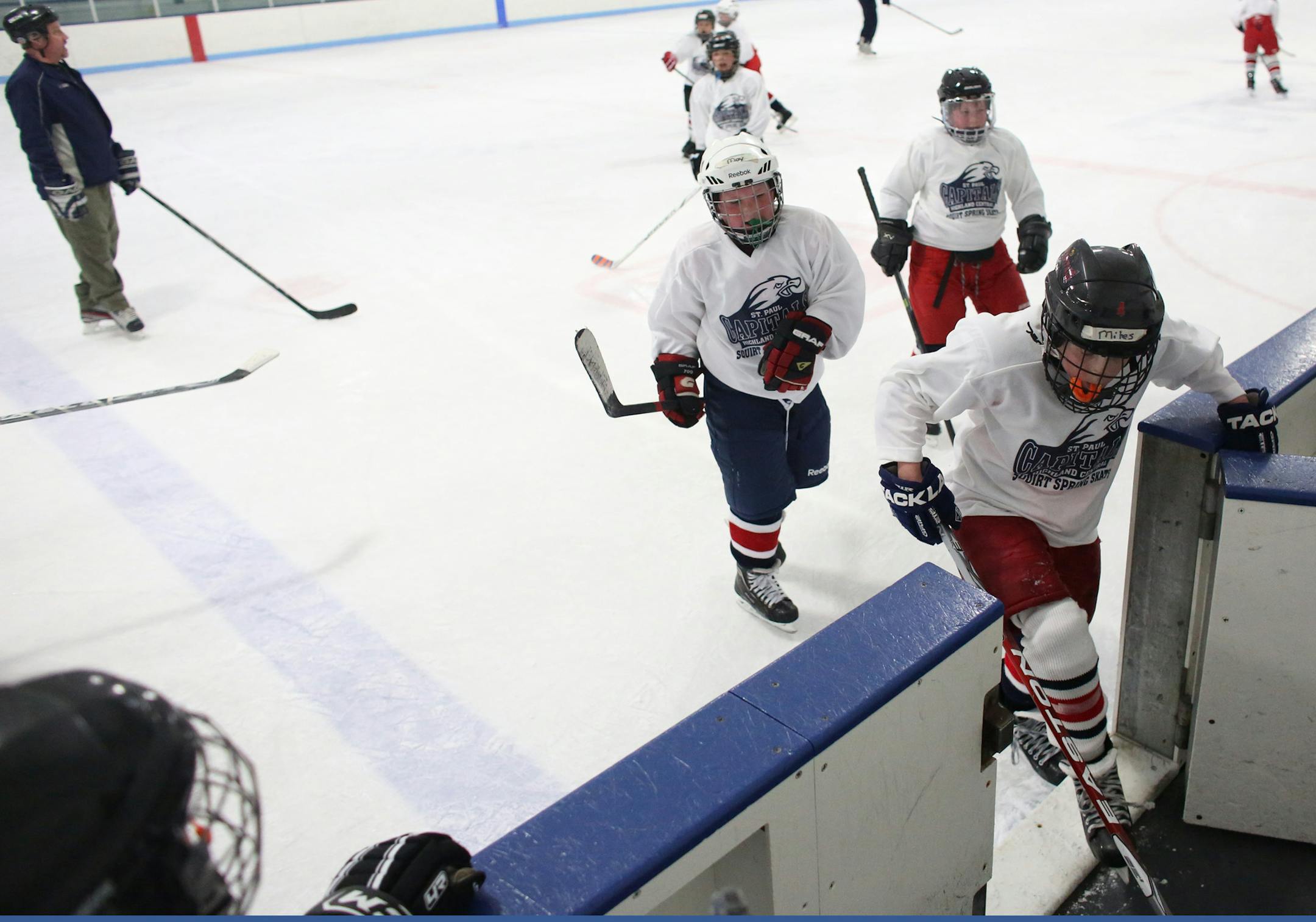 The St. Paul Capitols squirts headed back to the bench during a shift change as they played at the Highland Ice Arena. ] (KYNDELL HARKNESS/STAR TRIBUNE) kyndell.harkness@startribune.com With youth participation down and the number of St. Paul high school teams dropping from 6 to 3 in recent years, Ramsey County is beginning a discussion on the future of its 11 ice sheets in the changing marketplace. At the Highland Ice Arena in St. Paul, Min, Thursday, April 3, 2014.