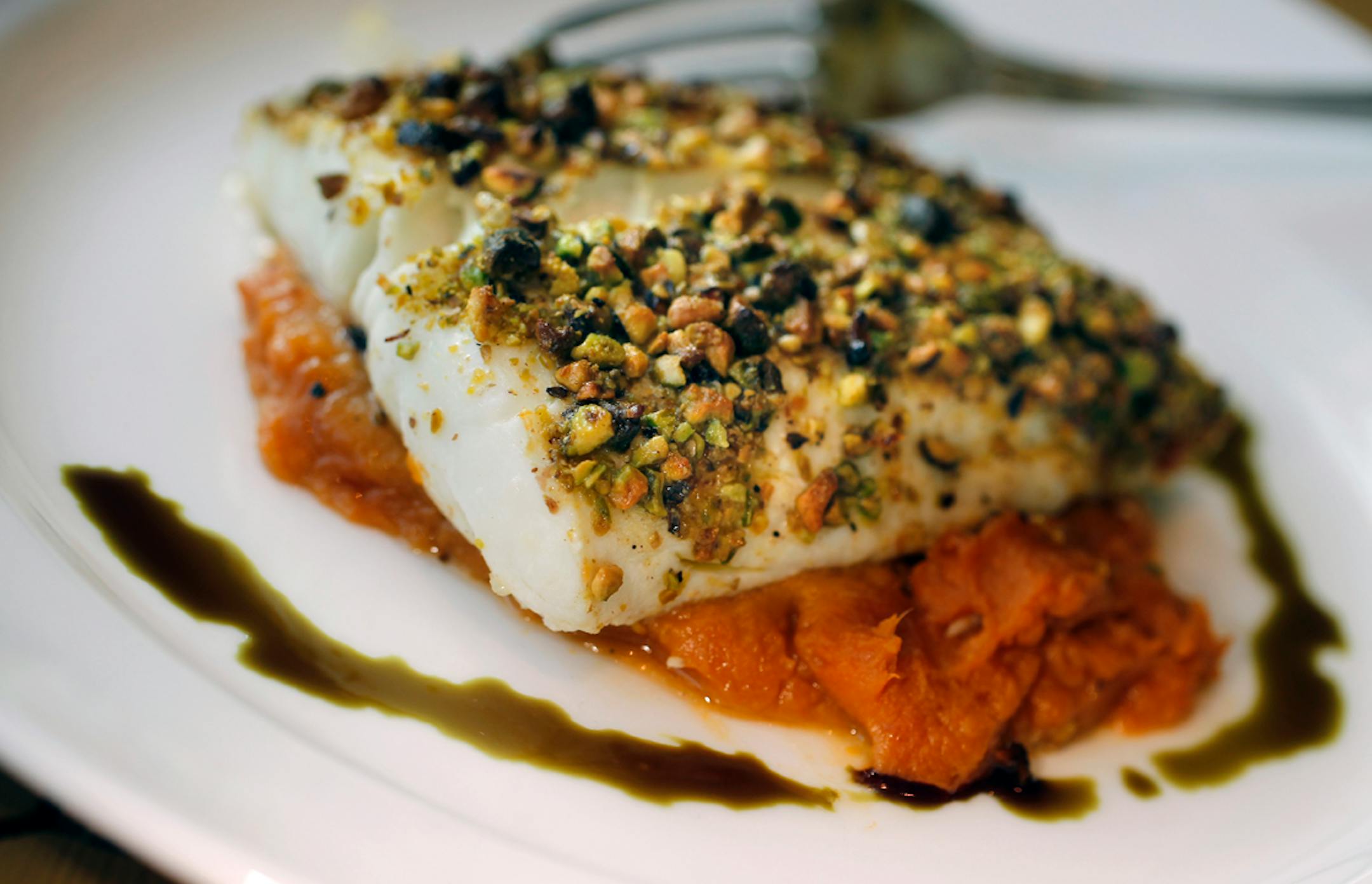 The pistachio-crusted grilled halibut at Blue Point