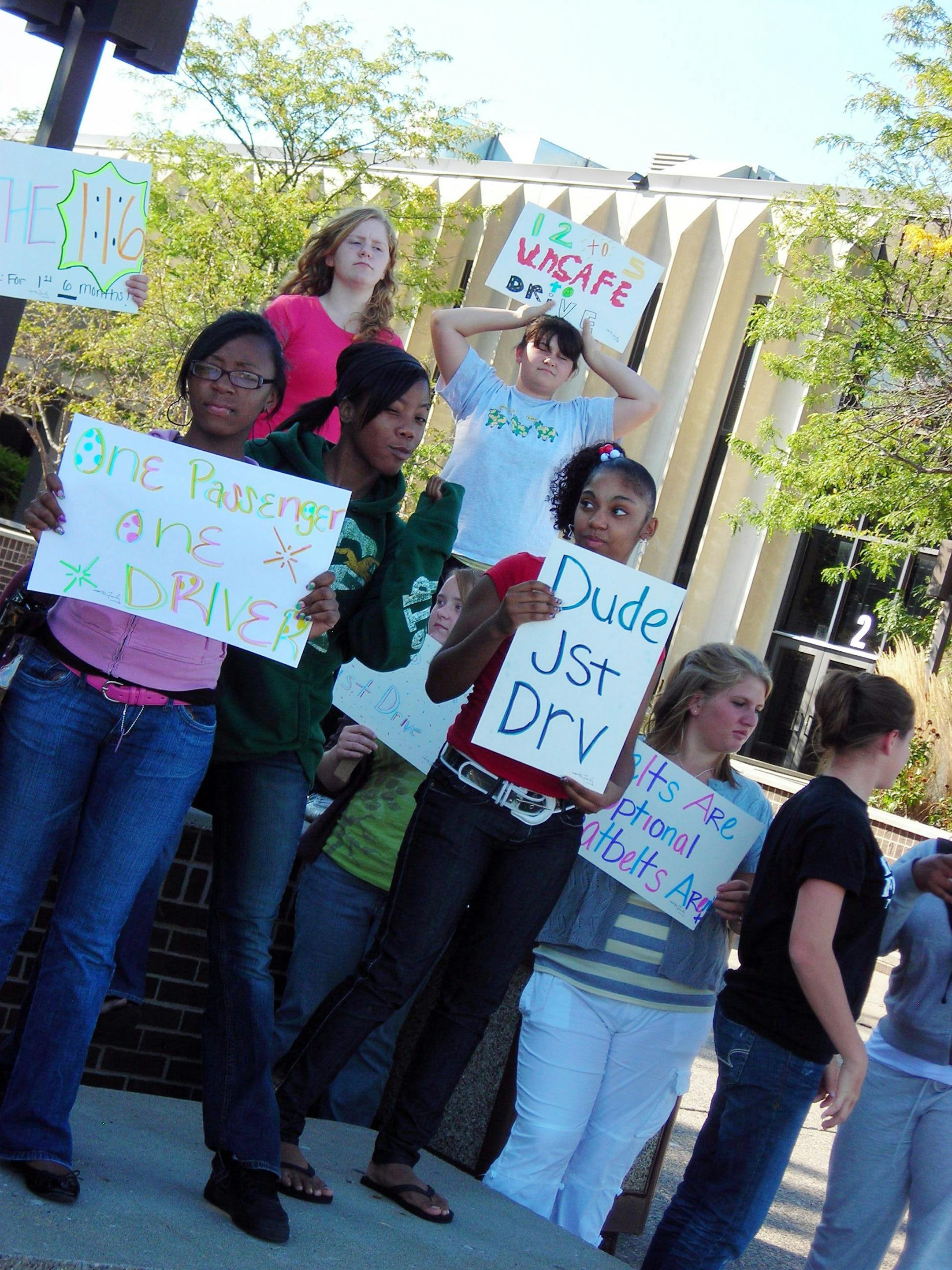 Photo credit: Patricia Halsey 10/2008 Anoka High School SADD students promote their DUDE JST DRV campaign to get teen drivers to put away their cell phones and texting devices.