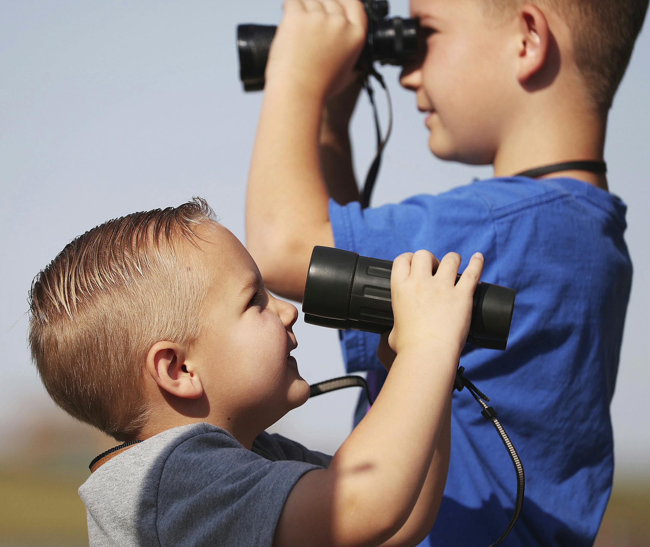 Look for birding events geared to all ages. Bridger Fowlks, left, and his brother Wyatt look for birds at the new Eccles Wildlife Education Center opens in Farmington, Utah.