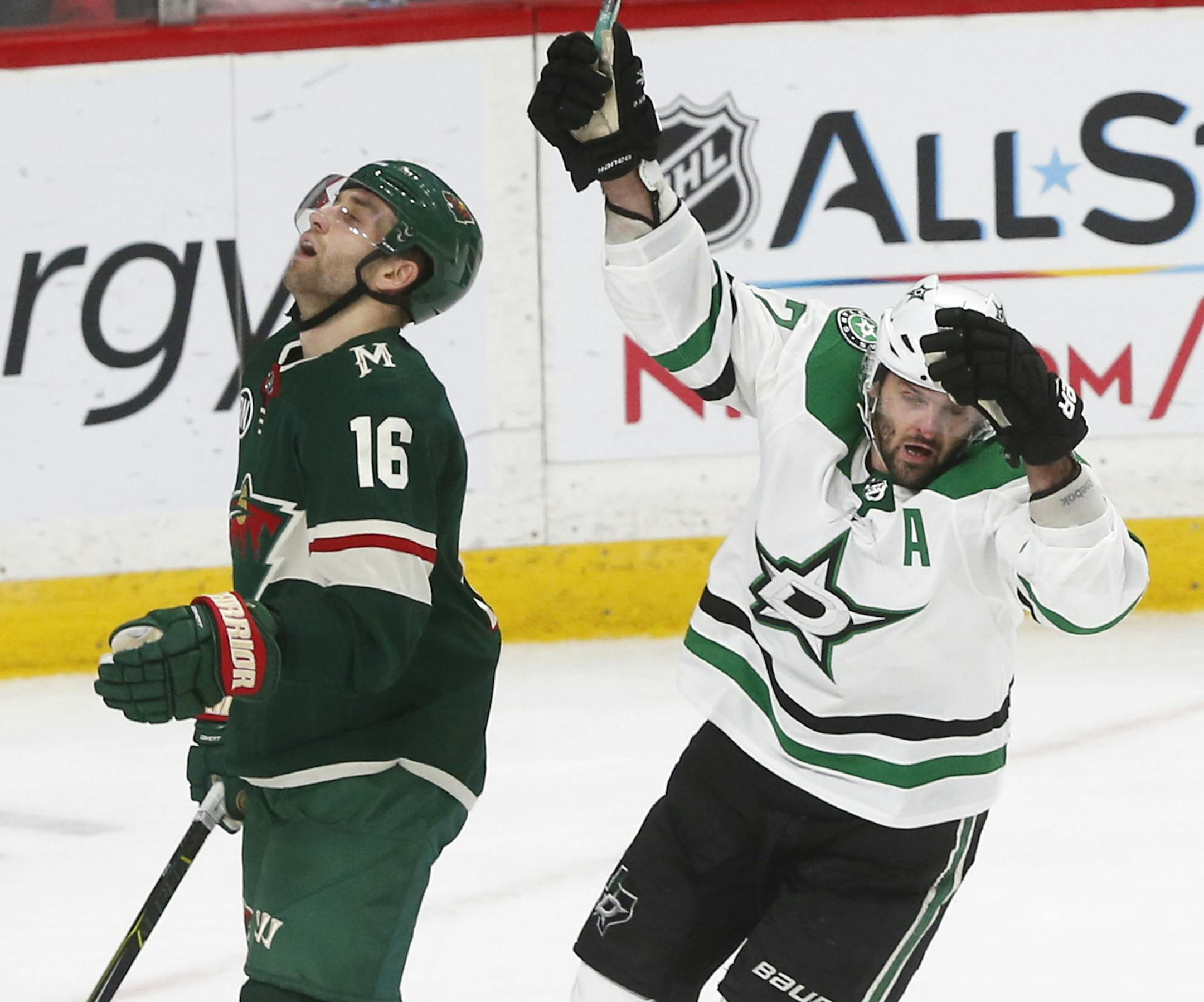 Dallas Stars' Alexander Radulov, right, of Russia, celebrates his game-winning goal in overtime as Minnesota Wild's Jason Zucker reacts in an NHL hockey game Saturday, Dec. 22, 2018, in St. Paul, Minn. The Stars won 2-1. Zucker tied the game with a third period goal (AP Photo/Jim Mone)
