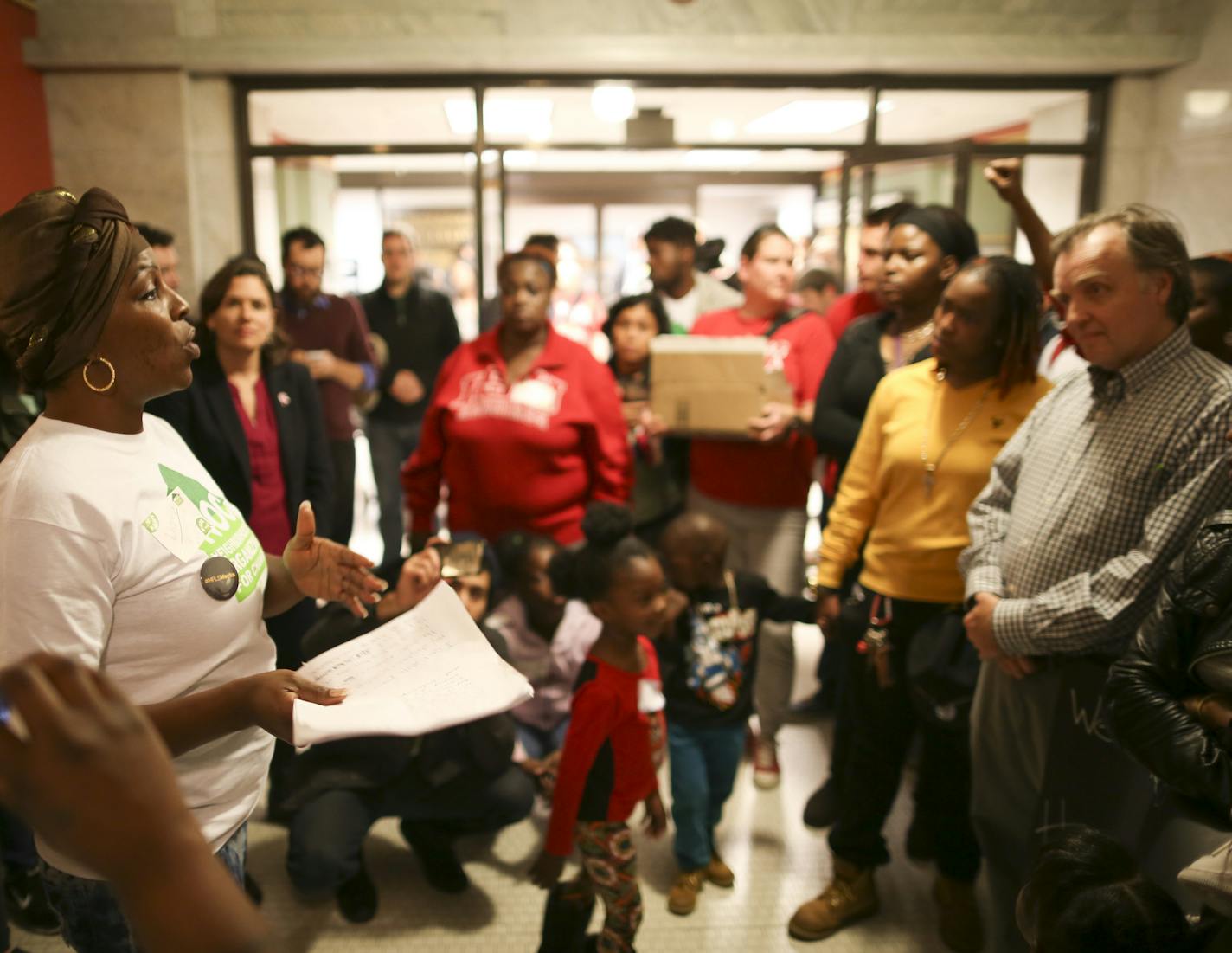 Laretha Rapp, a Target Field worker, spoke outside the City Council offices about the difficulty she has had with scheduling at her job. Listening to her concerns was Minneapolis council member Cam Gordon, right, Thursday afternoon at City Hall. ] JEFF WHEELER &#xef; jeff.wheeler@startribune.com Several groups banded together Thursday afternoon, October 15, 2015 to rally and protest Minneapolis Mayor Betsy Hodges decision not to pursue scheduling initiatives included in her Working Families Agen