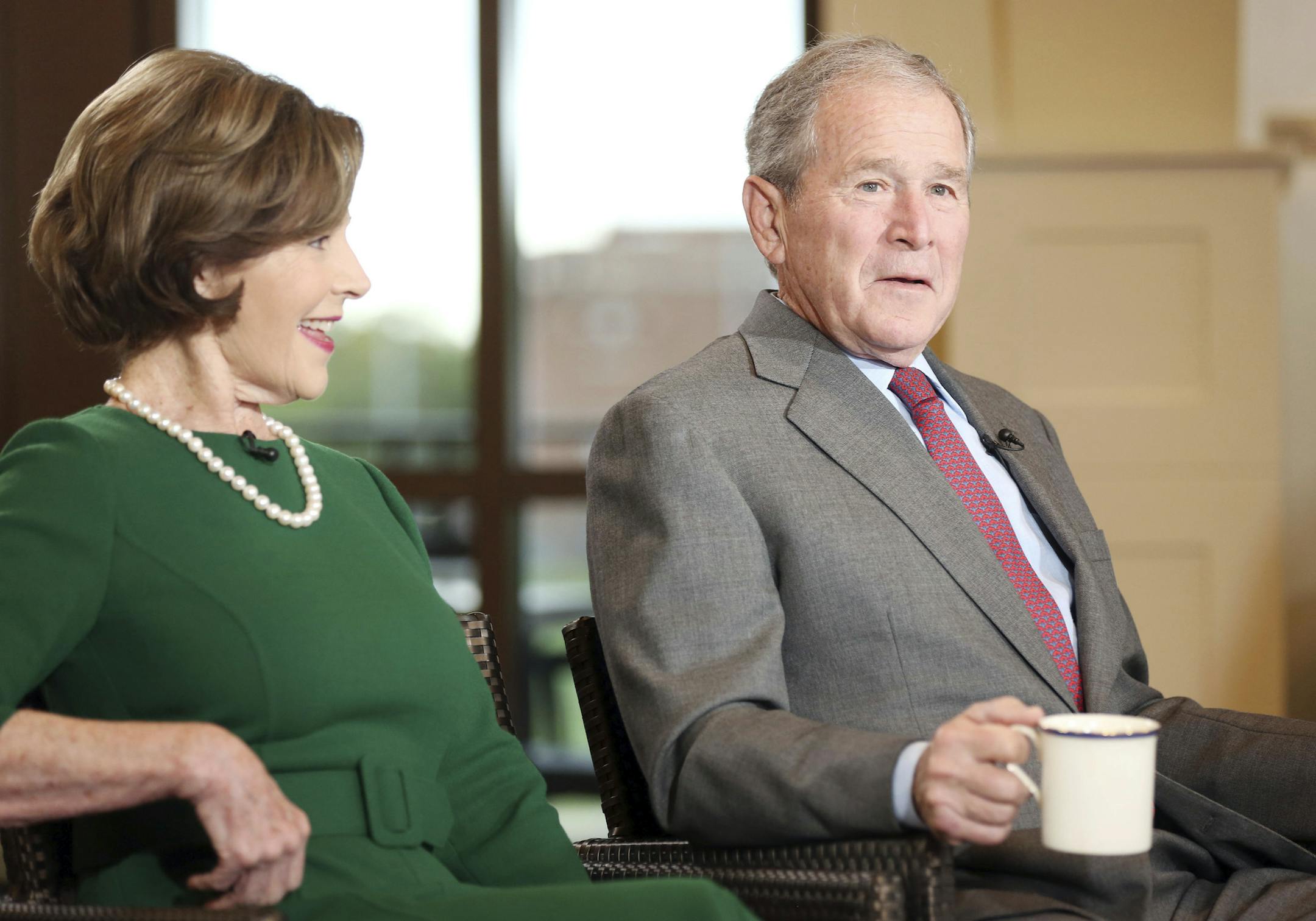 Former President George W. Bush and Laura Bush are interviewed by host Maria Bartiromo on the "Mornings with Maria Bartiromo" program on the Fox Business Network at the George W. Bush Presidential Library, Wednesday, April 18, 2018, in Dallas. (AP Photo/Brandon Wade)